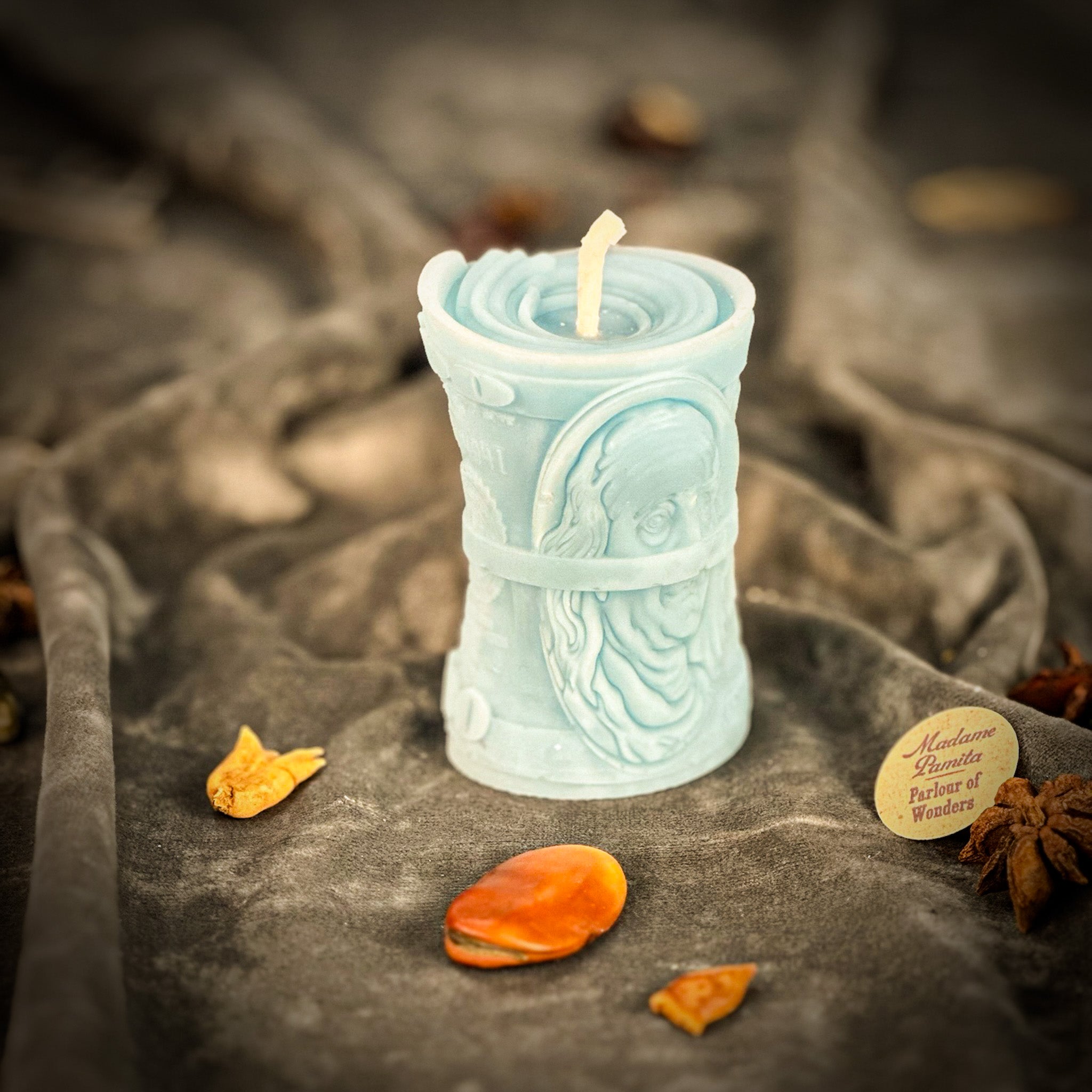 Green beeswax candle by Parlour of Wonders for debt collection and fair compensation, featuring natural beeswax and spiritual design.