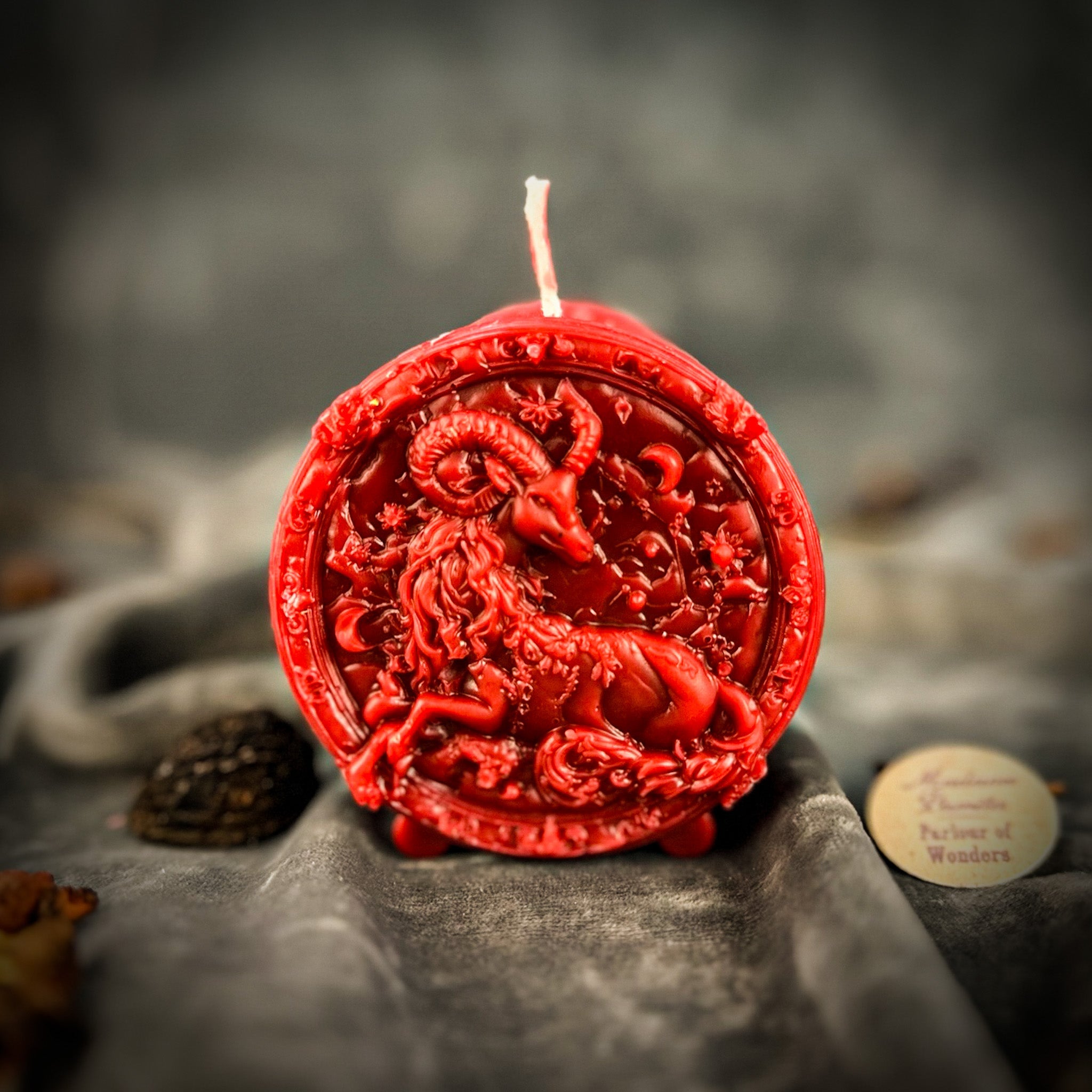 Green beeswax candle featuring a Capricorn goat zodiac design, symbolizing ambition, discipline, and success.