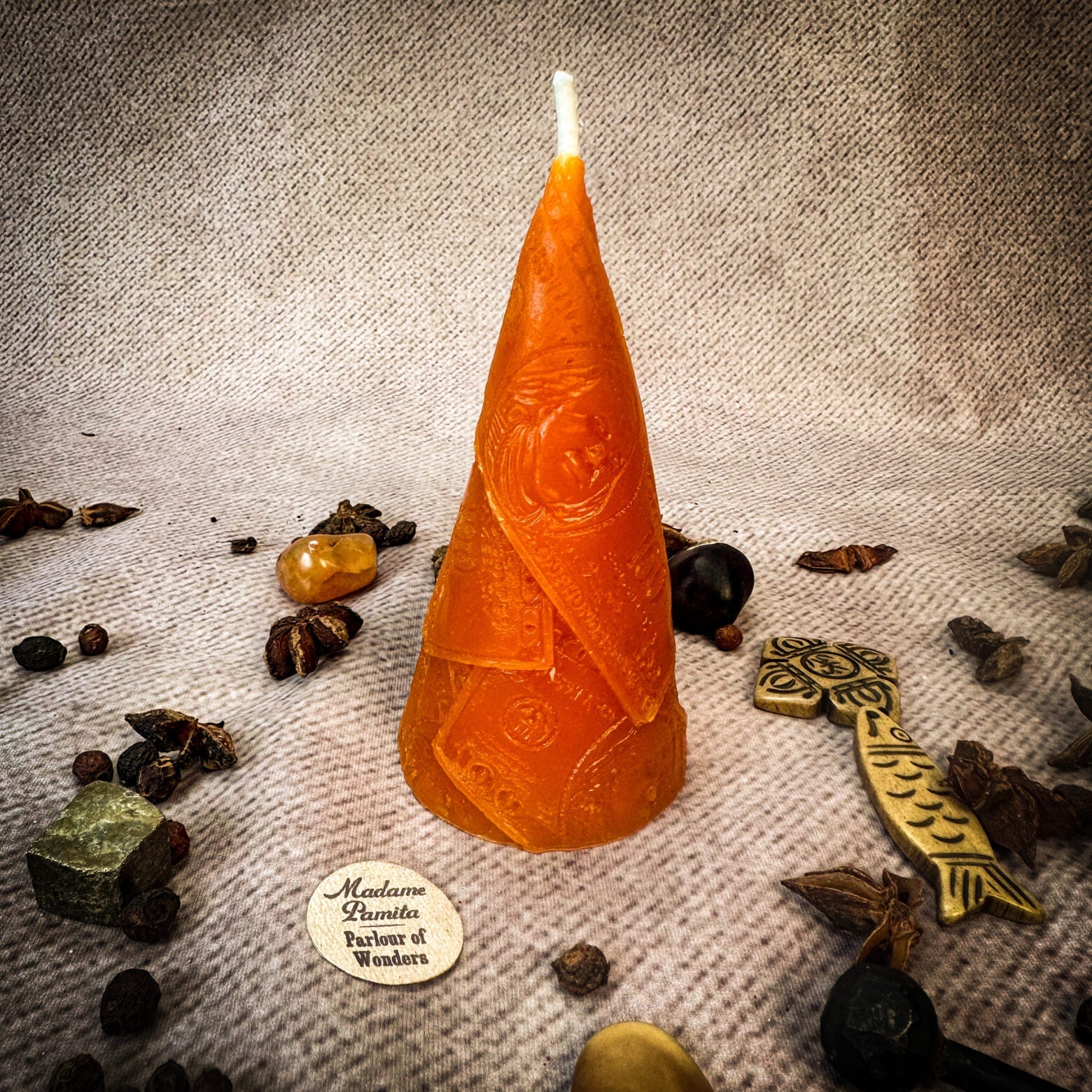 Green beeswax candle by Parlour of Wonders for prosperity and abundance magic, featuring intricate beeswax design.