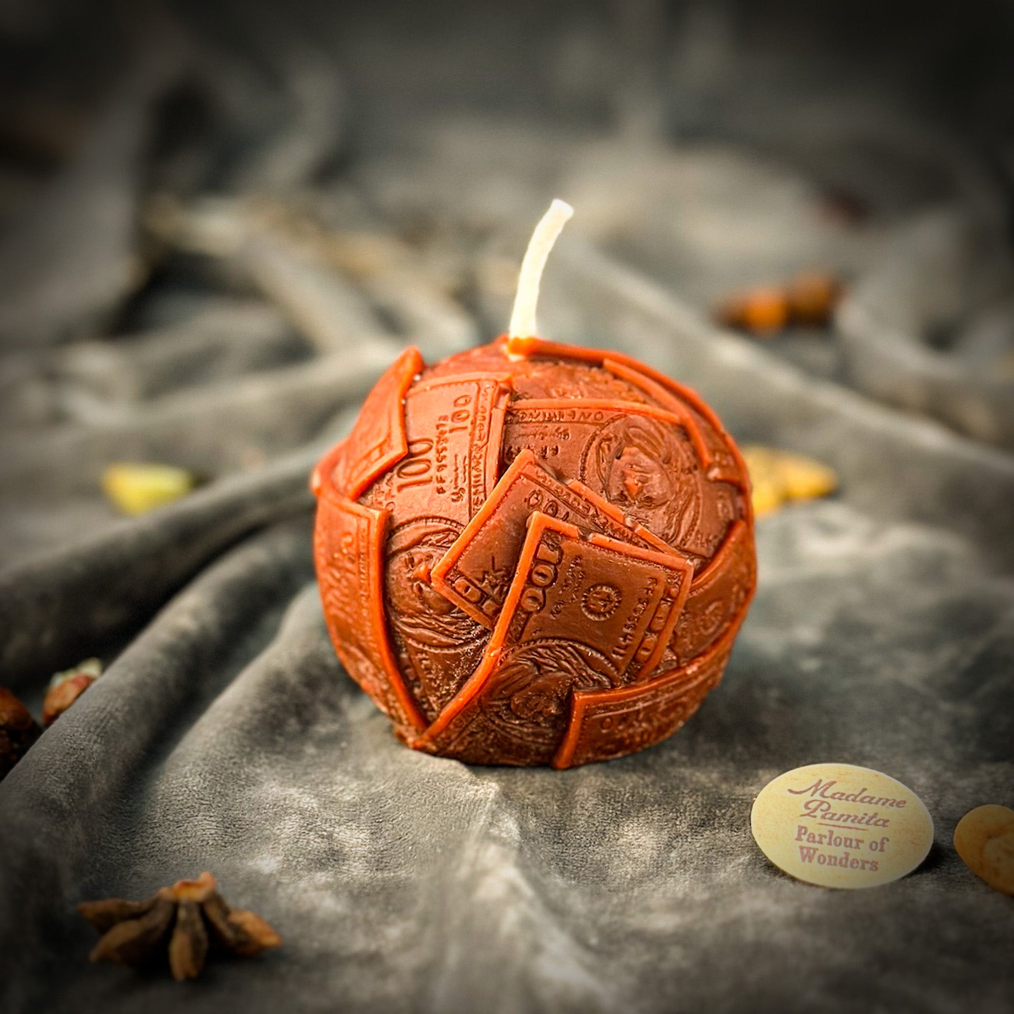 Green beeswax candle labeled "Rolling in Dough" by Parlour of Wonders, featuring intricate wax details symbolizing wealth and abundance.