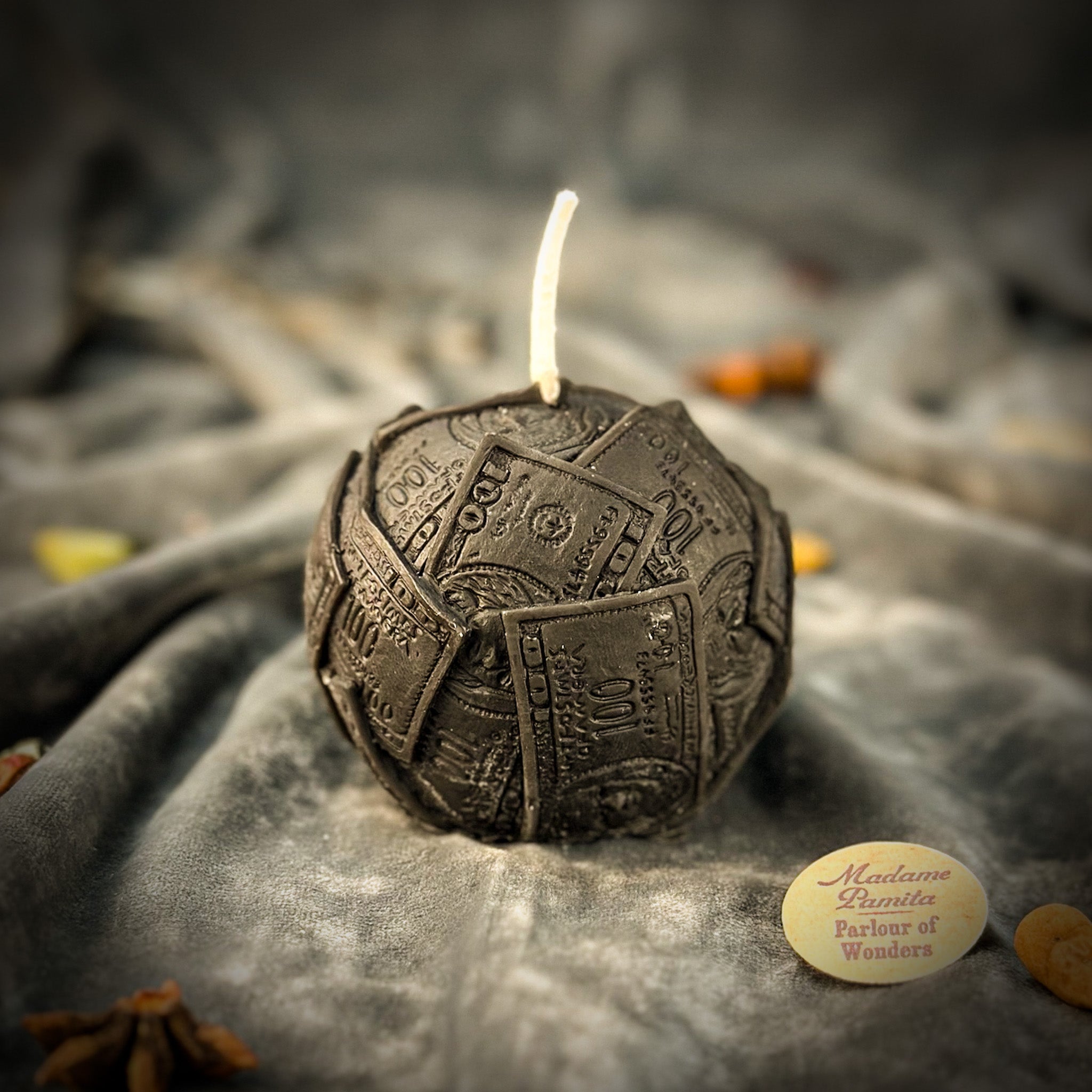 Green beeswax candle by Parlour of Wonders featuring a rolling dough design, symbolizing wealth and abundance.