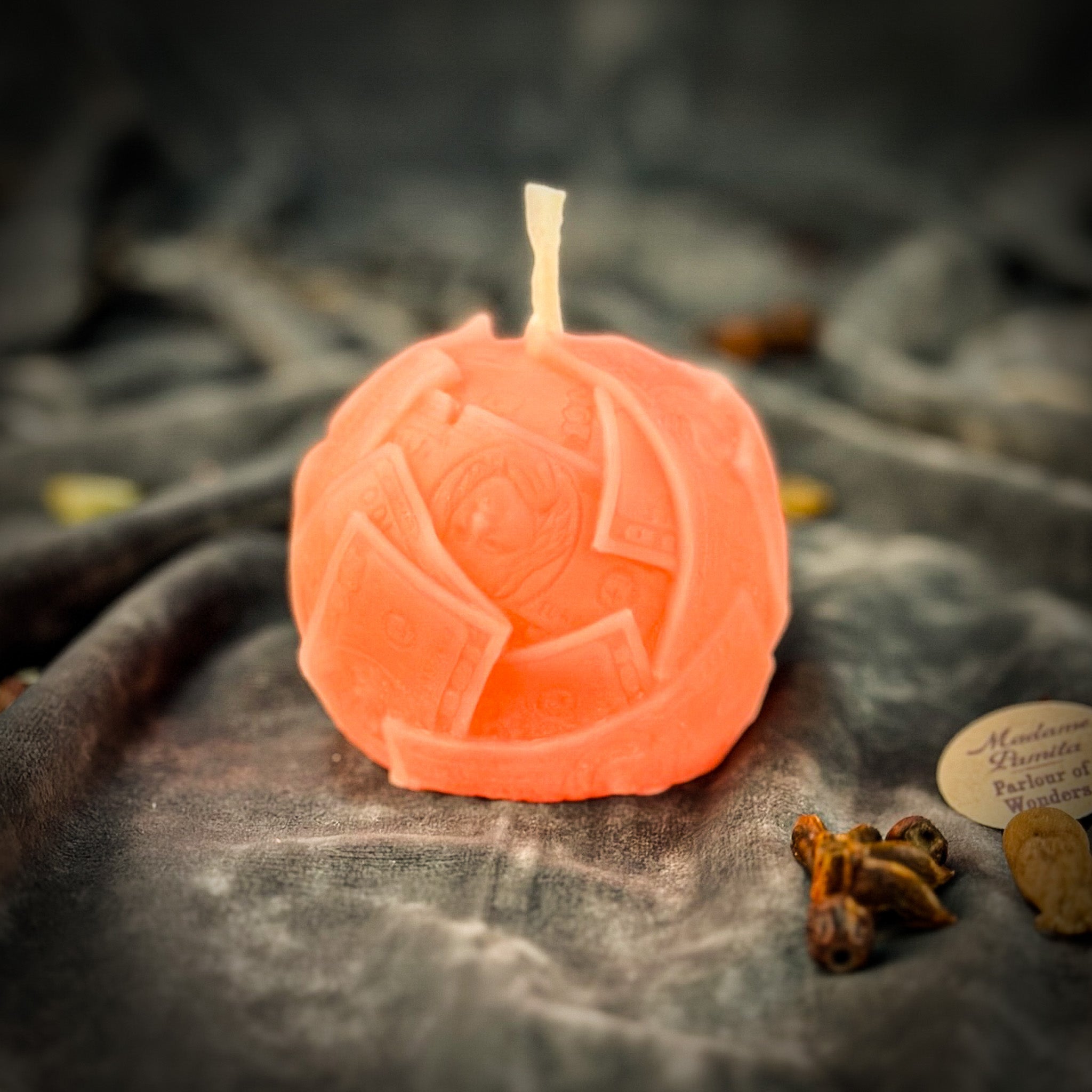 Green beeswax candle with rolling dough design by Parlour of Wonders, symbolizing wealth and abundance.