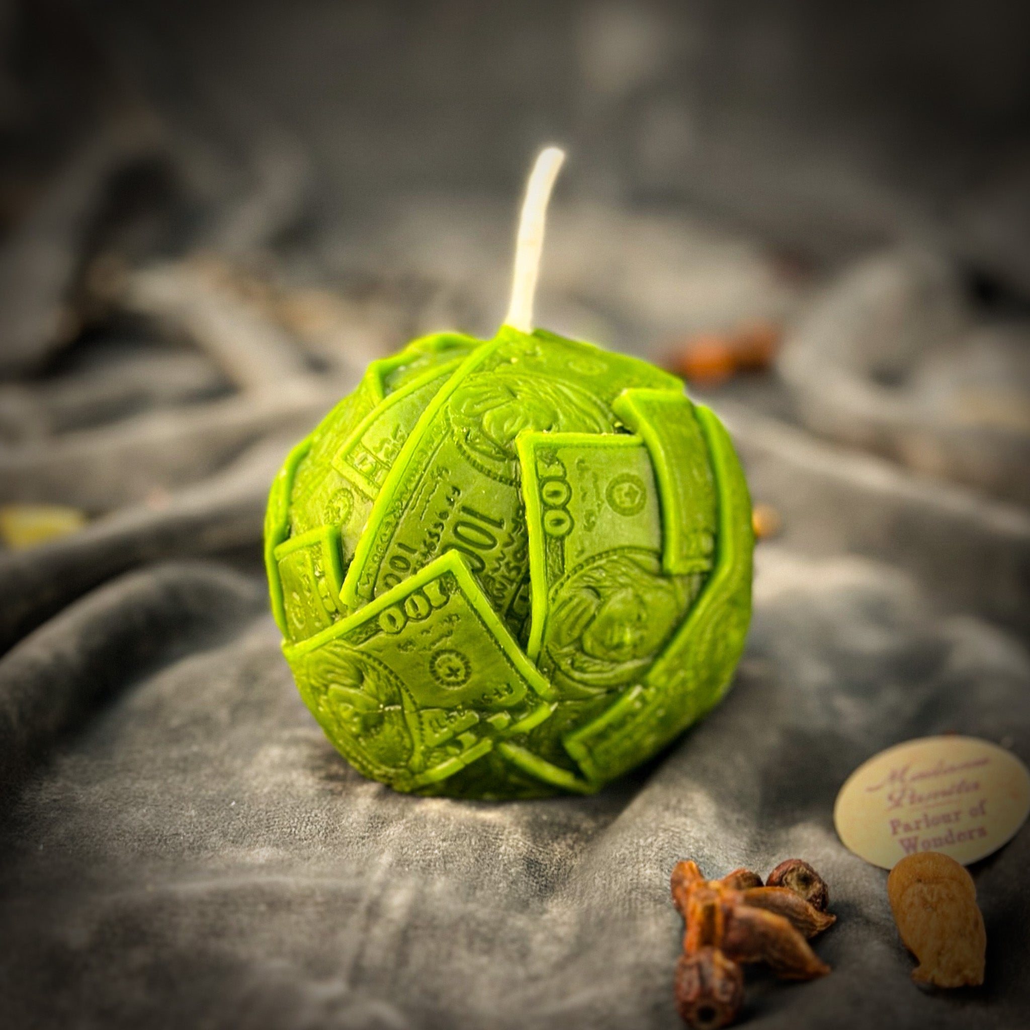 Green beeswax candle with rolling dough design by Parlour of Wonders, symbolizing wealth and abundance for luxury home decor.