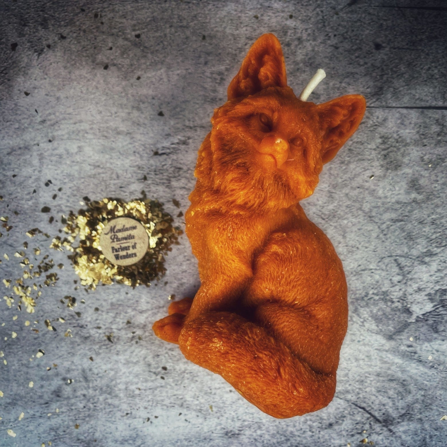 Orange beeswax candle by Parlour of Wonders, designed for quick results and cunning magic with a fox spell theme.
