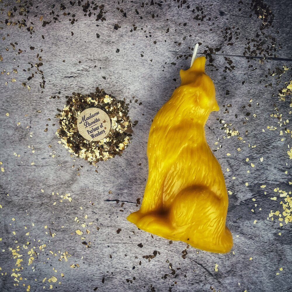 Beeswax Howling Wolf Spell Candle by Parlour of Wonders, orange beeswax candle for courage and authentic voice magic.