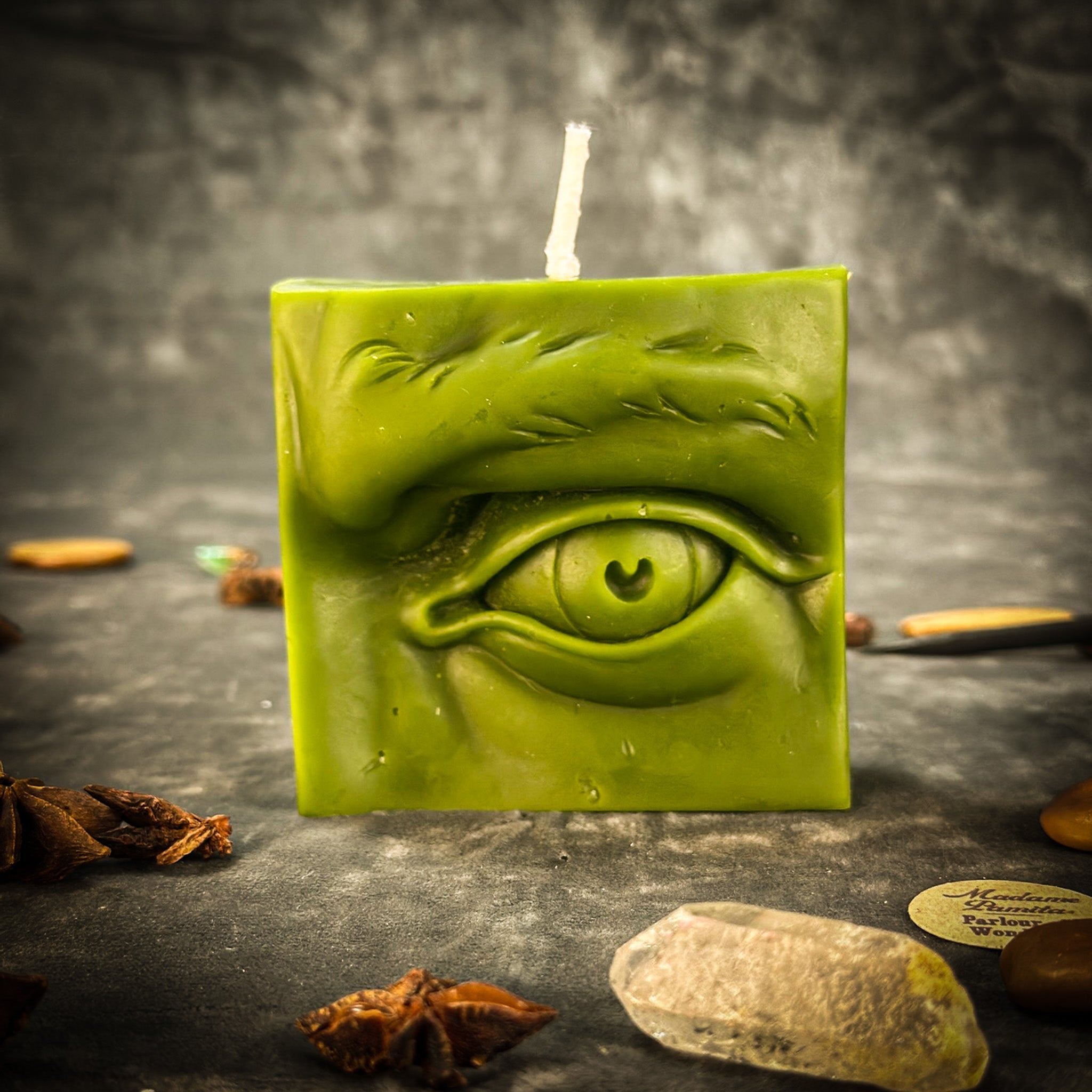 Beeswax Ex-Voto Eye Spell Candle by Parlour of Wonders, orange beeswax candle for vision, clairvoyance, and being seen, with eye design.