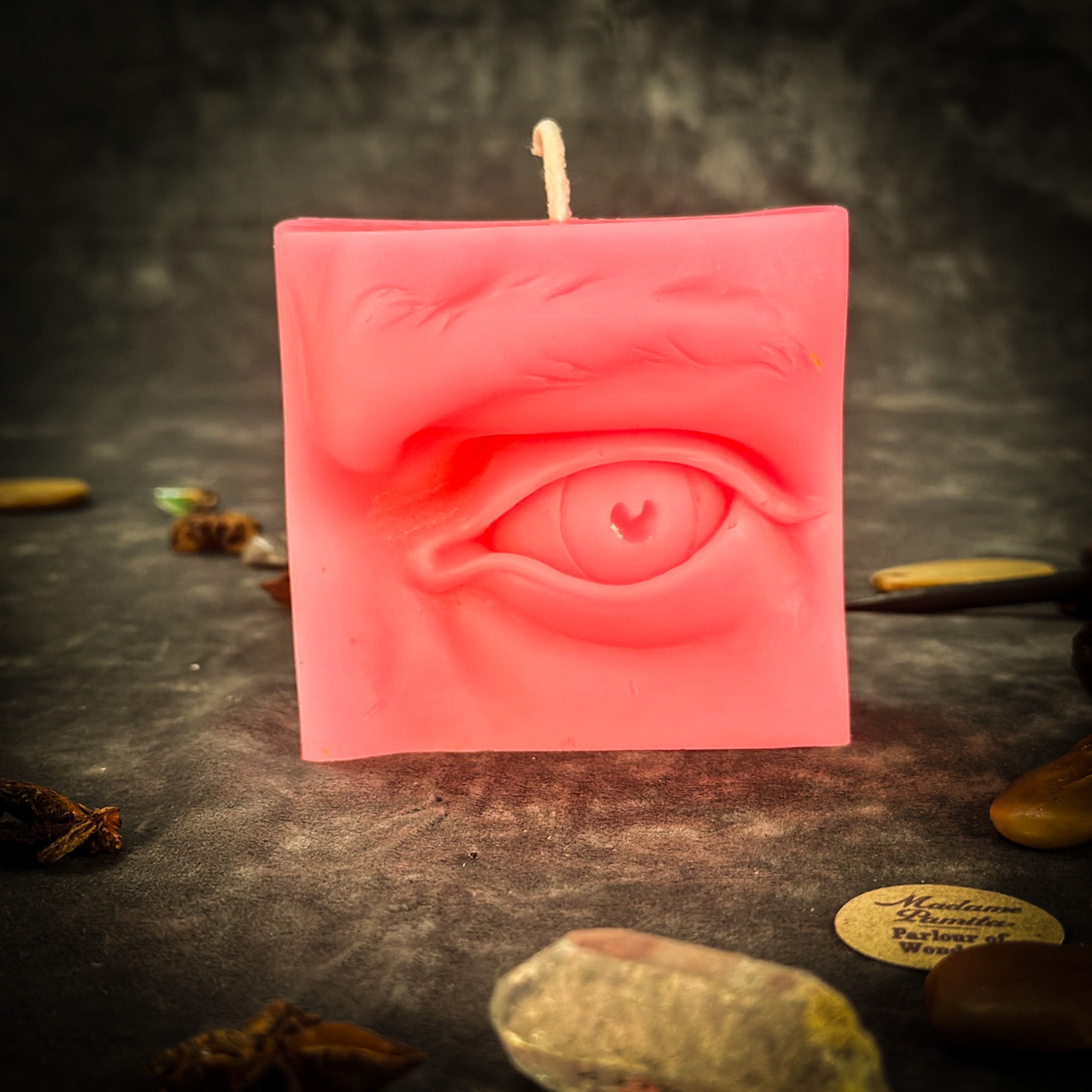 Beeswax Ex-Voto Eye Spell Candle by Parlour of Wonders with orange wax for vision, clairvoyance, and being seen.
