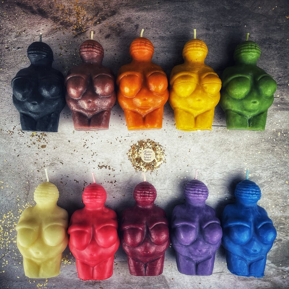 Beeswax Goddess of Willendorf spell candle by Parlour of Wonders, featuring feminine power and fertility magic in an orange beeswax design.