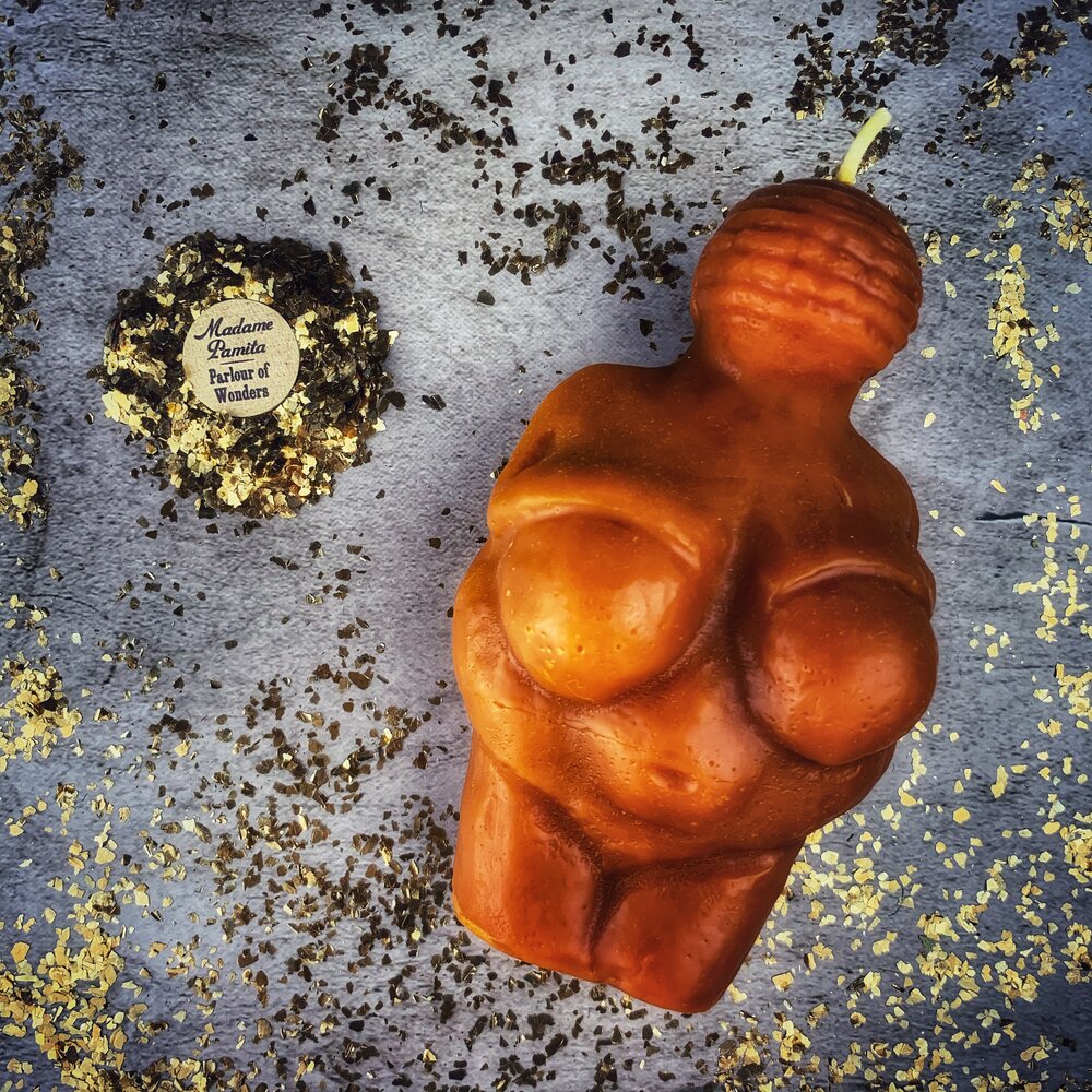 Beeswax Goddess of Willendorf Spell Candle by Parlour of Wonders, featuring feminine power and fertility magic with orange accents.