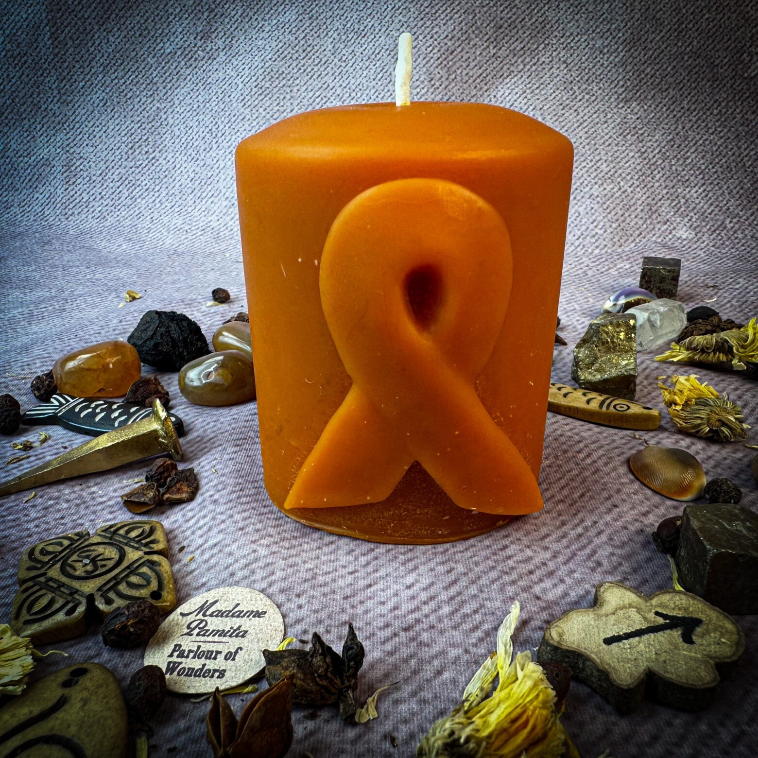 Beeswax pillar candle with awareness ribbon design by Parlour of Wonders, honoring heroes and supporting causes.