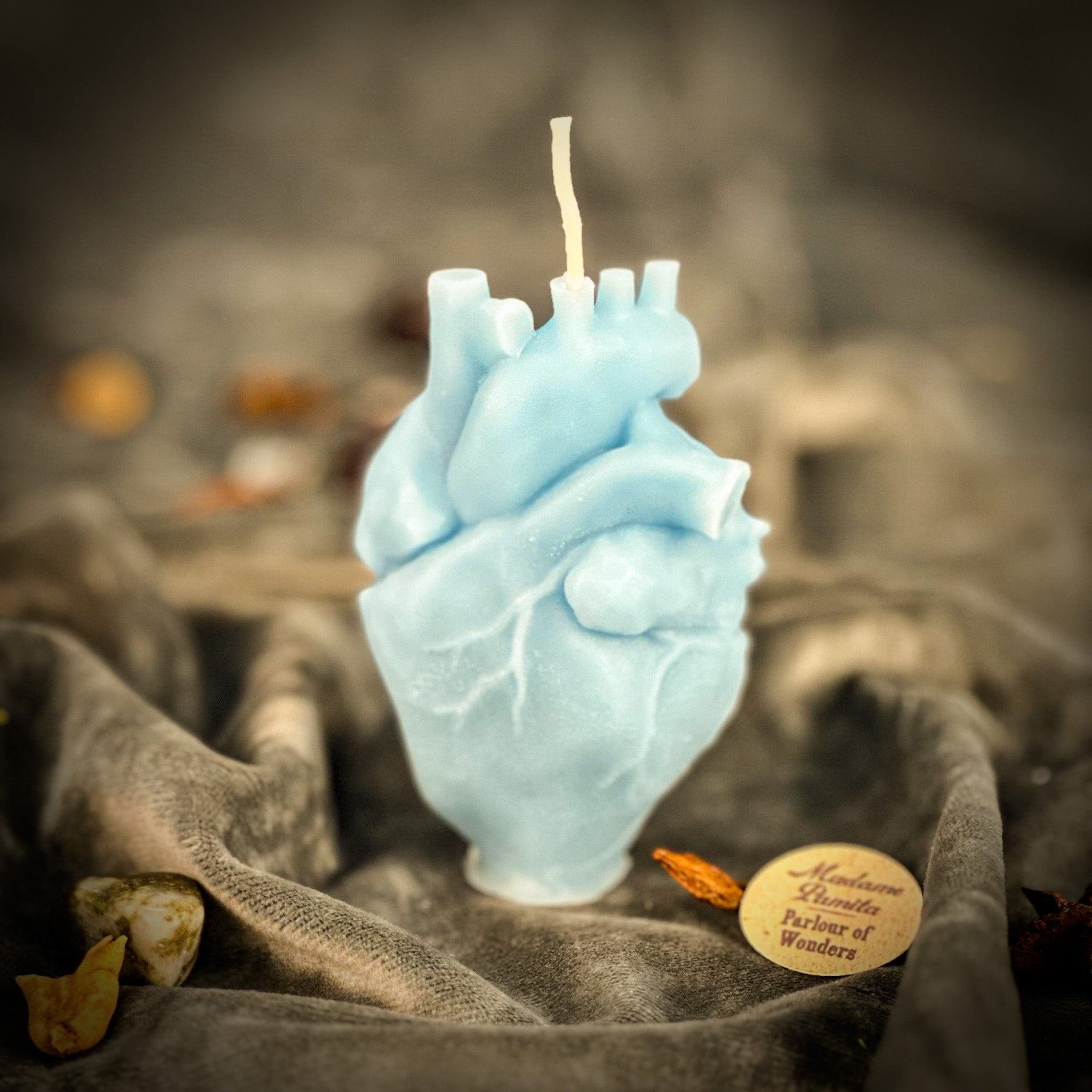 Pink beeswax anatomical heart candle by Parlour of Wonders, designed for love and emotional healing magic.