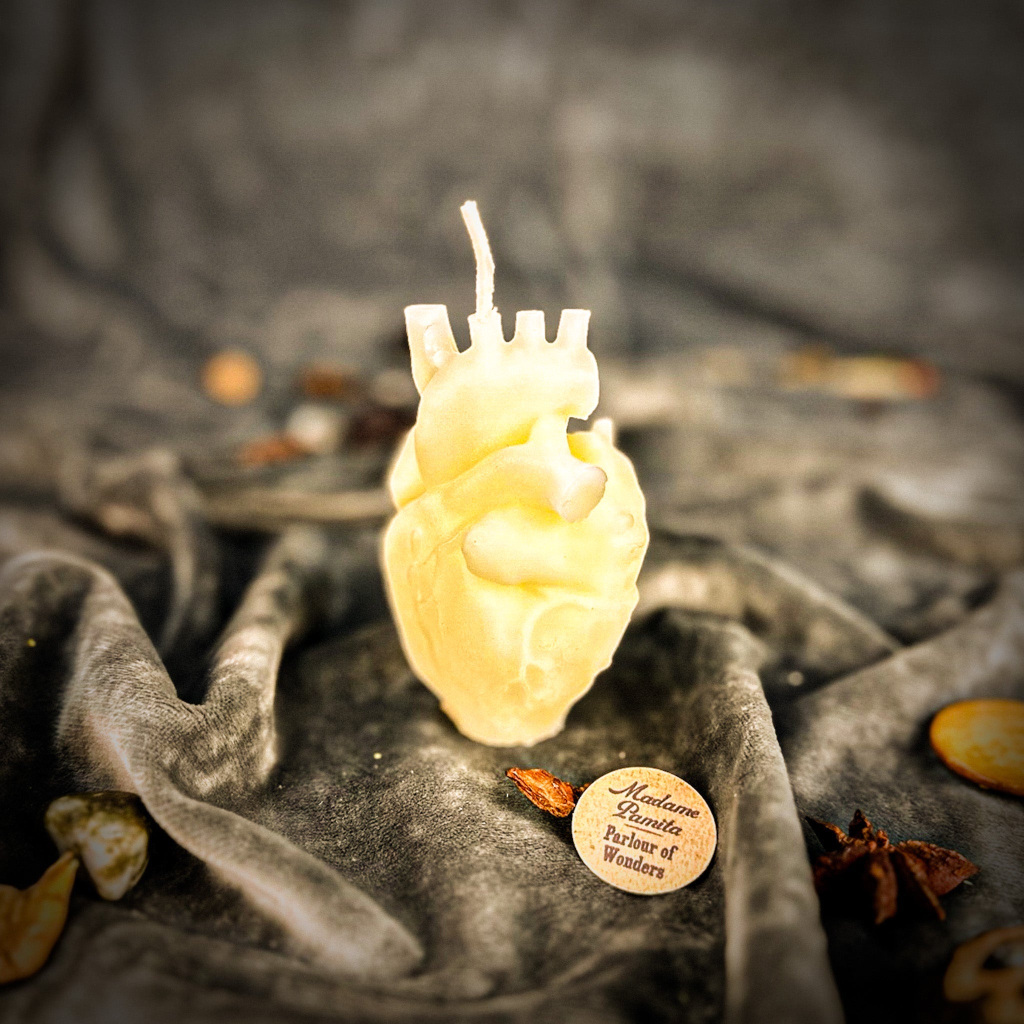 Pink beeswax anatomical heart candle by Parlour of Wonders, designed for love and emotional healing magic.