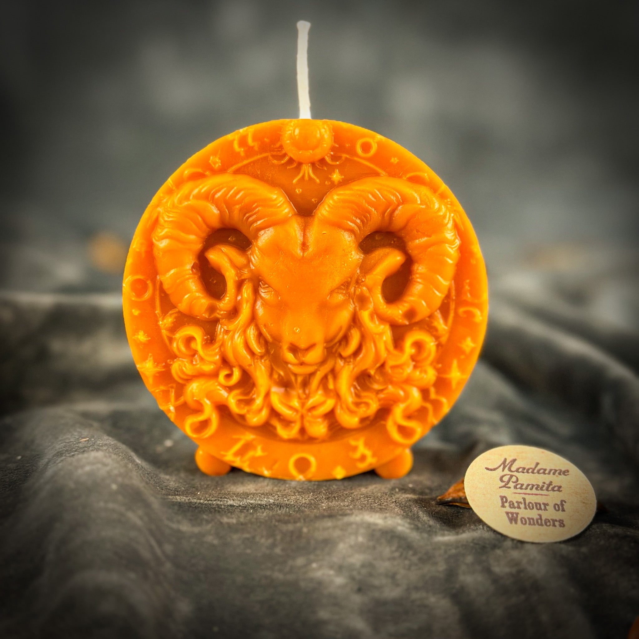 Pink beeswax Aries Ram zodiac spell candle from Parlour of Wonders, symbolizing courage, passion, and victory.