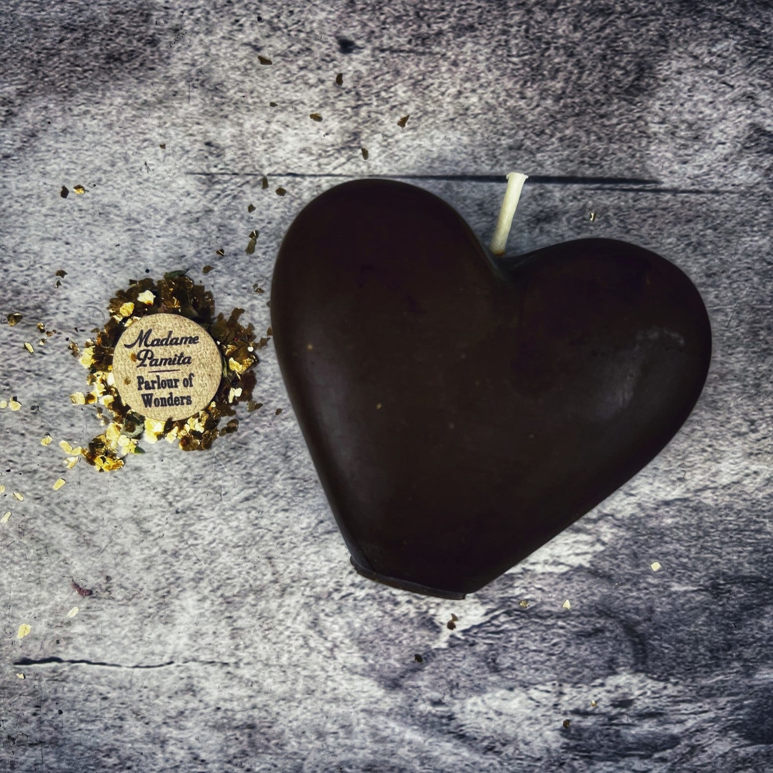 Pink beeswax candle by Parlour of Wonders for love reconciliation and emotional healing, with a heart-shaped design.