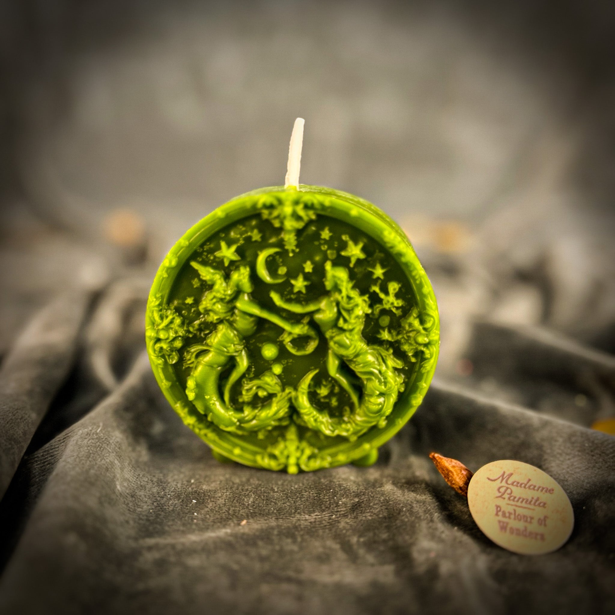 Pink beeswax Gemini Twins zodiac spell candle by Parlour of Wonders with symbols for communication, creativity, and adaptability.