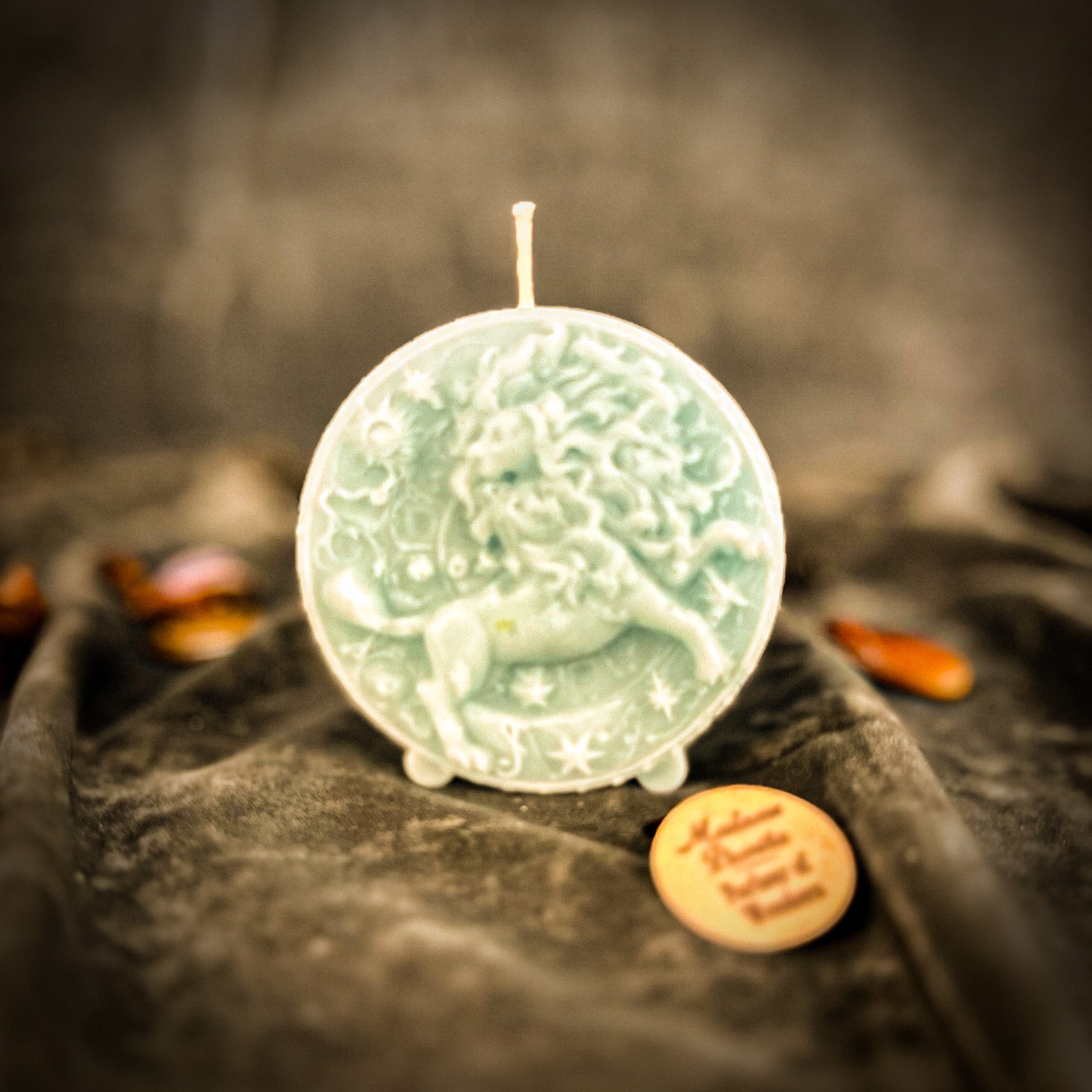 Pink beeswax Leo zodiac candle by Parlour of Wonders featuring a lion design, symbolizing creativity, confidence, and leadership.