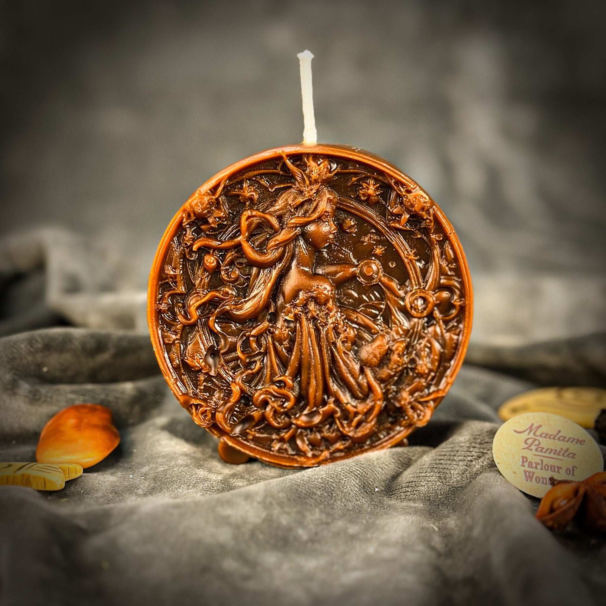 Pink beeswax Libra zodiac candle with scale and star design, symbolizing balance, harmony, and love, from Parlour of Wonders.