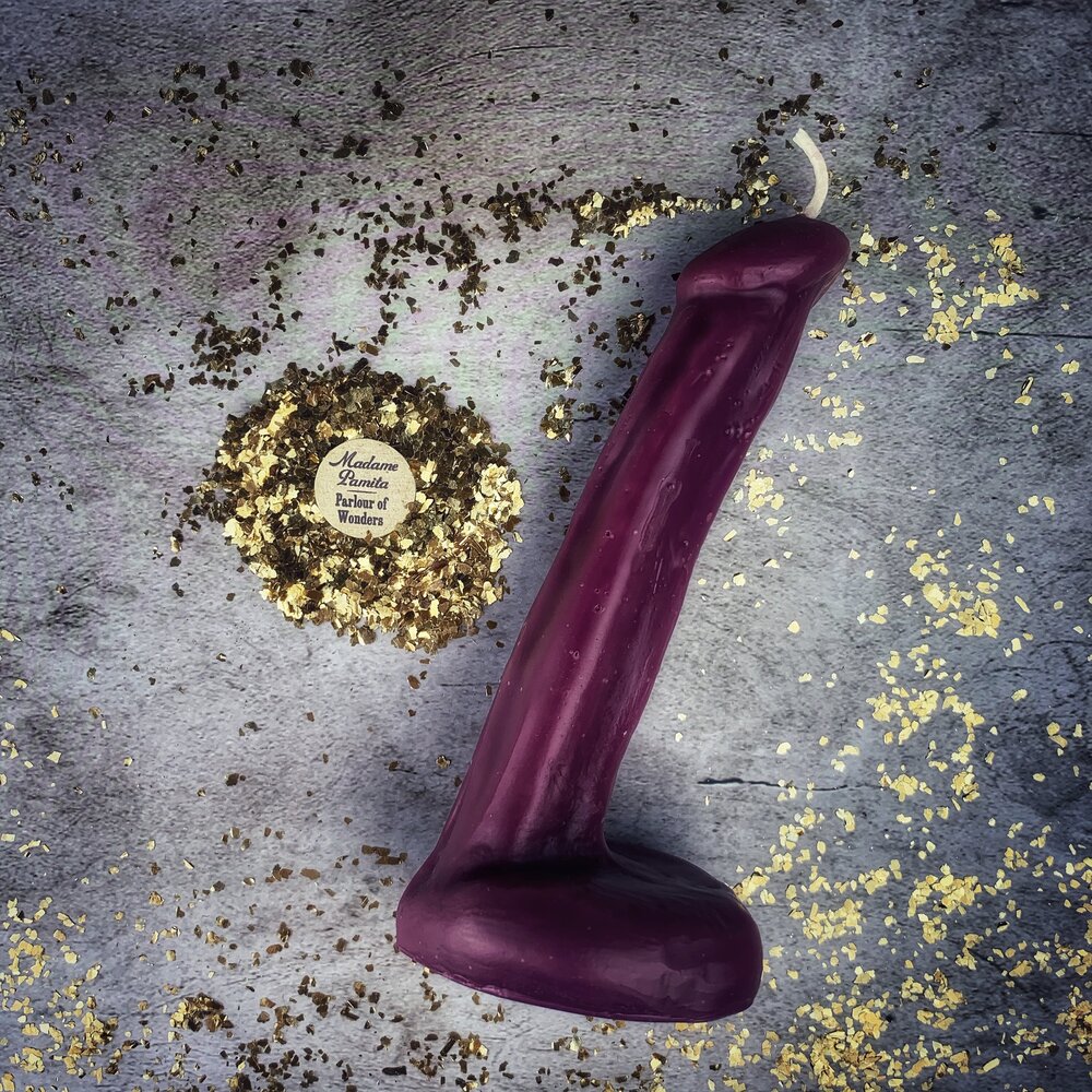 Pink beeswax phallus candle from Parlour of Wonders, used for passionate love and sex magic rituals.