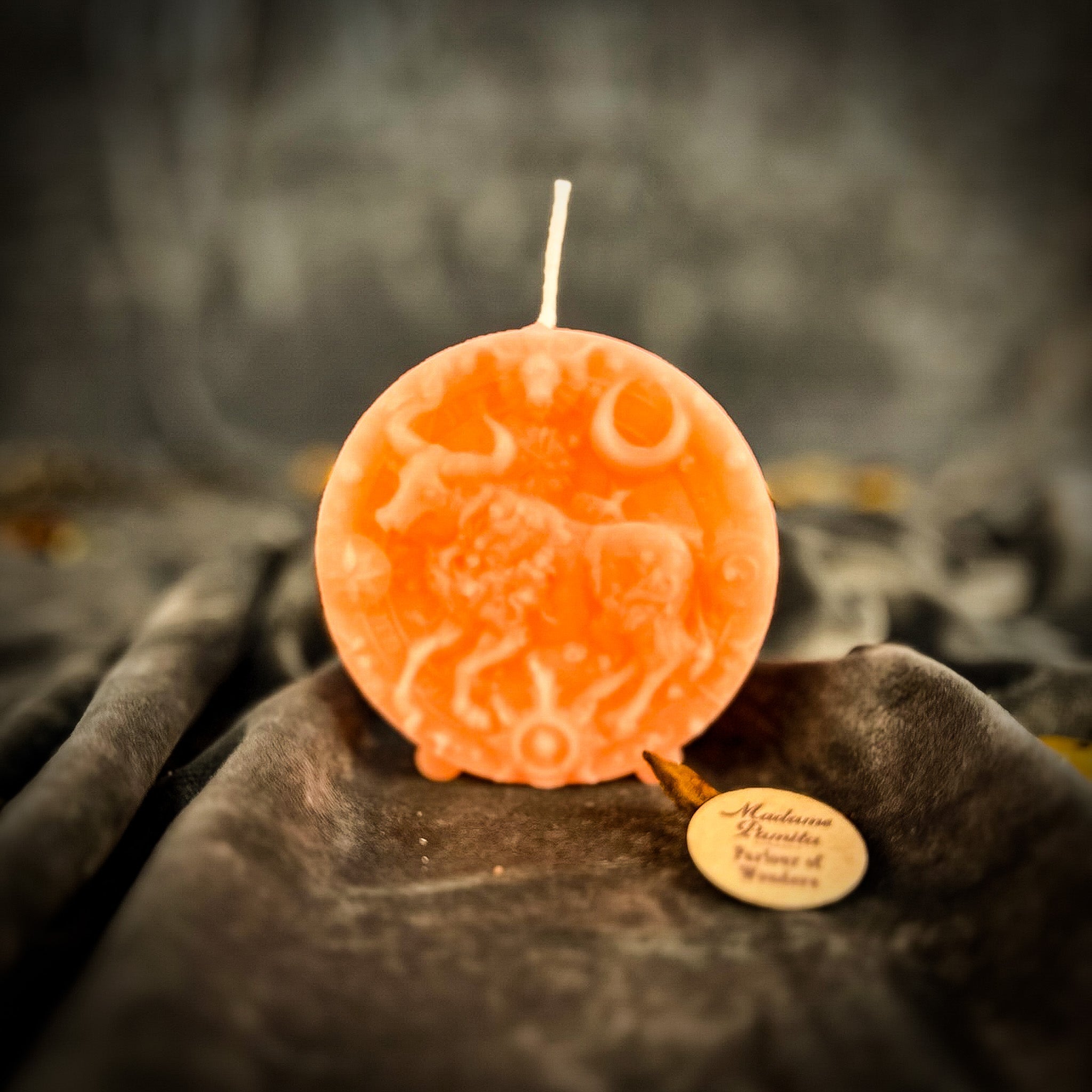 Pink beeswax Taurus Bull zodiac spell candle by Parlour of Wonders, symbolizing abundance, stability, and sensuality.