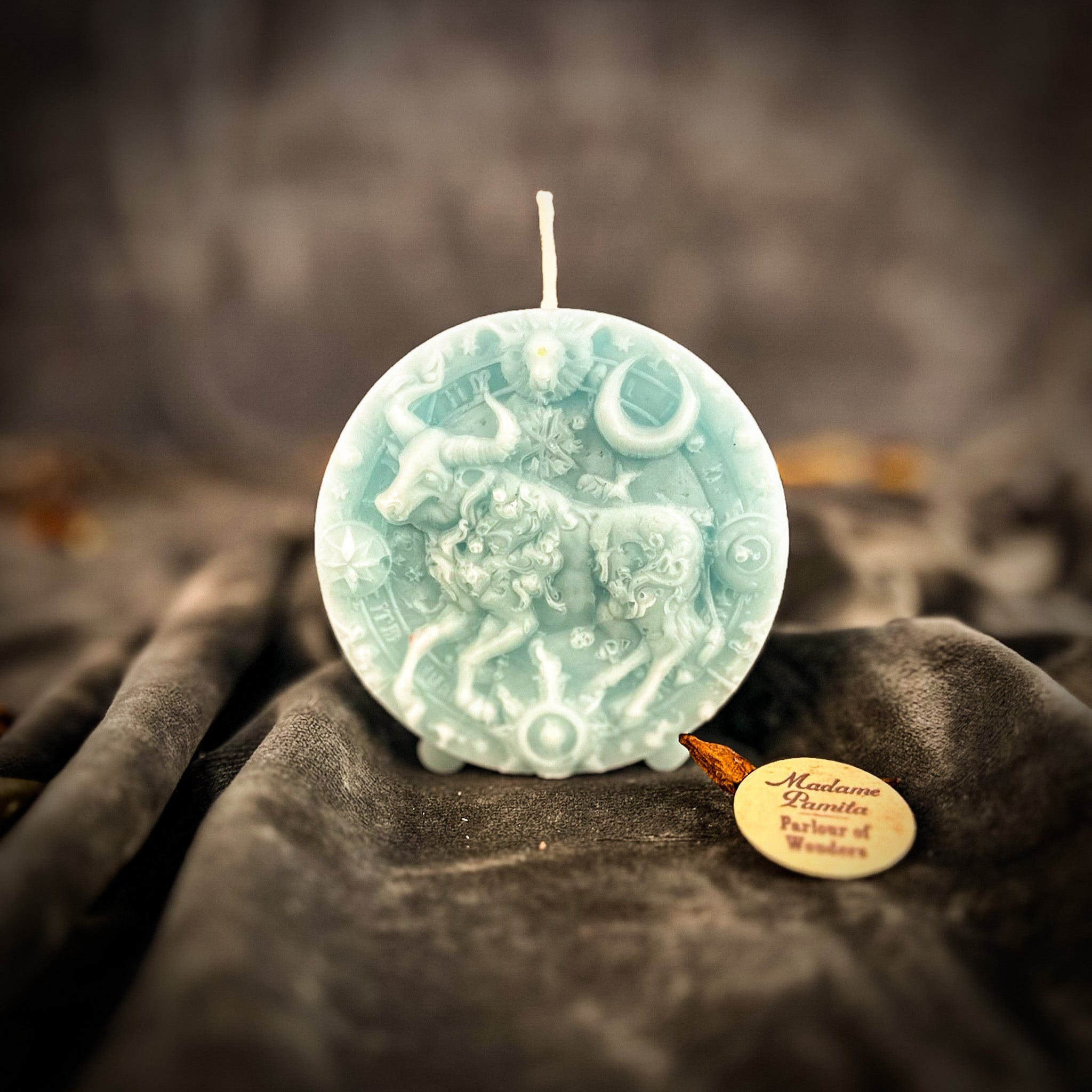 Pink beeswax Taurus Bull zodiac spell candle by Parlour of Wonders, symbolizing abundance, stability, and sensuality.