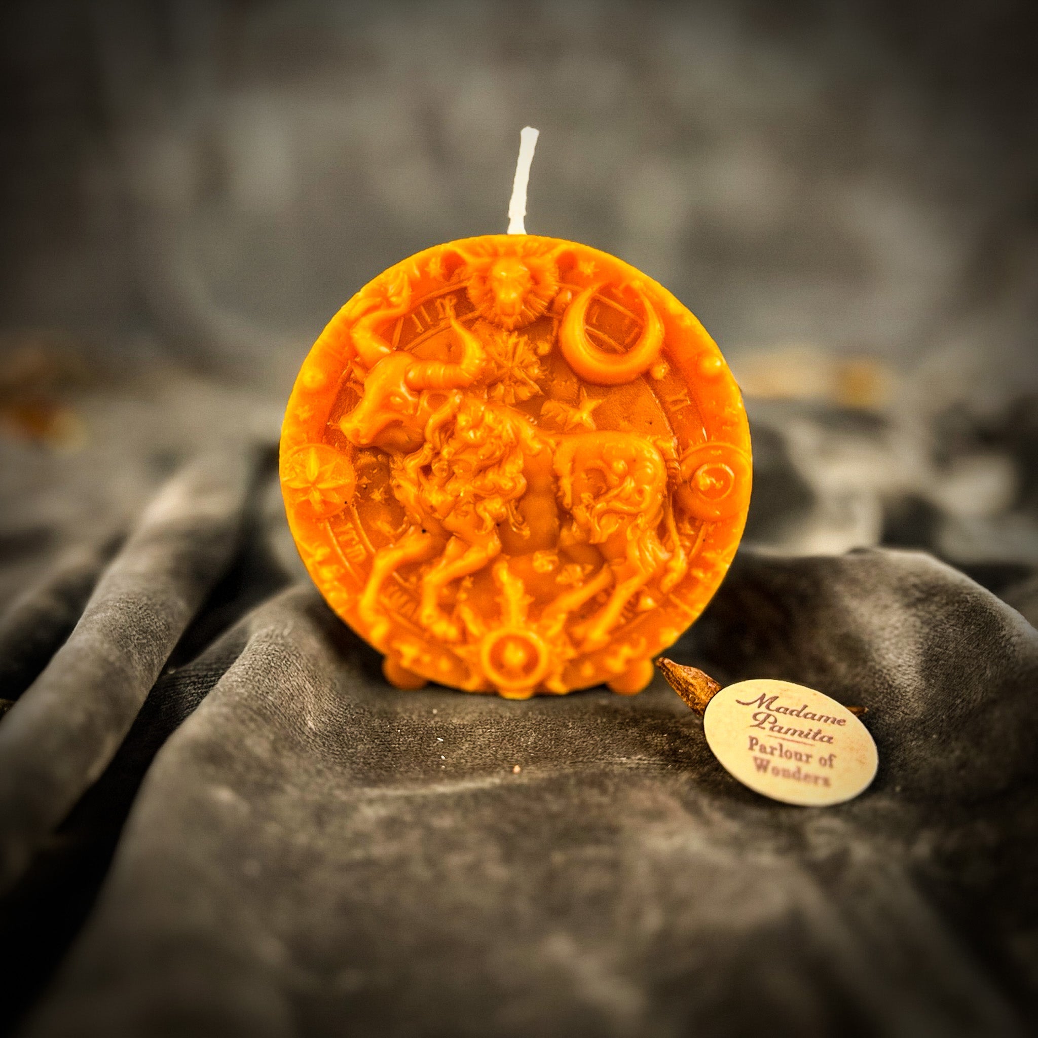 Pink beeswax Taurus Bull zodiac spell candle by Parlour of Wonders, symbolizing abundance, stability, and sensuality.