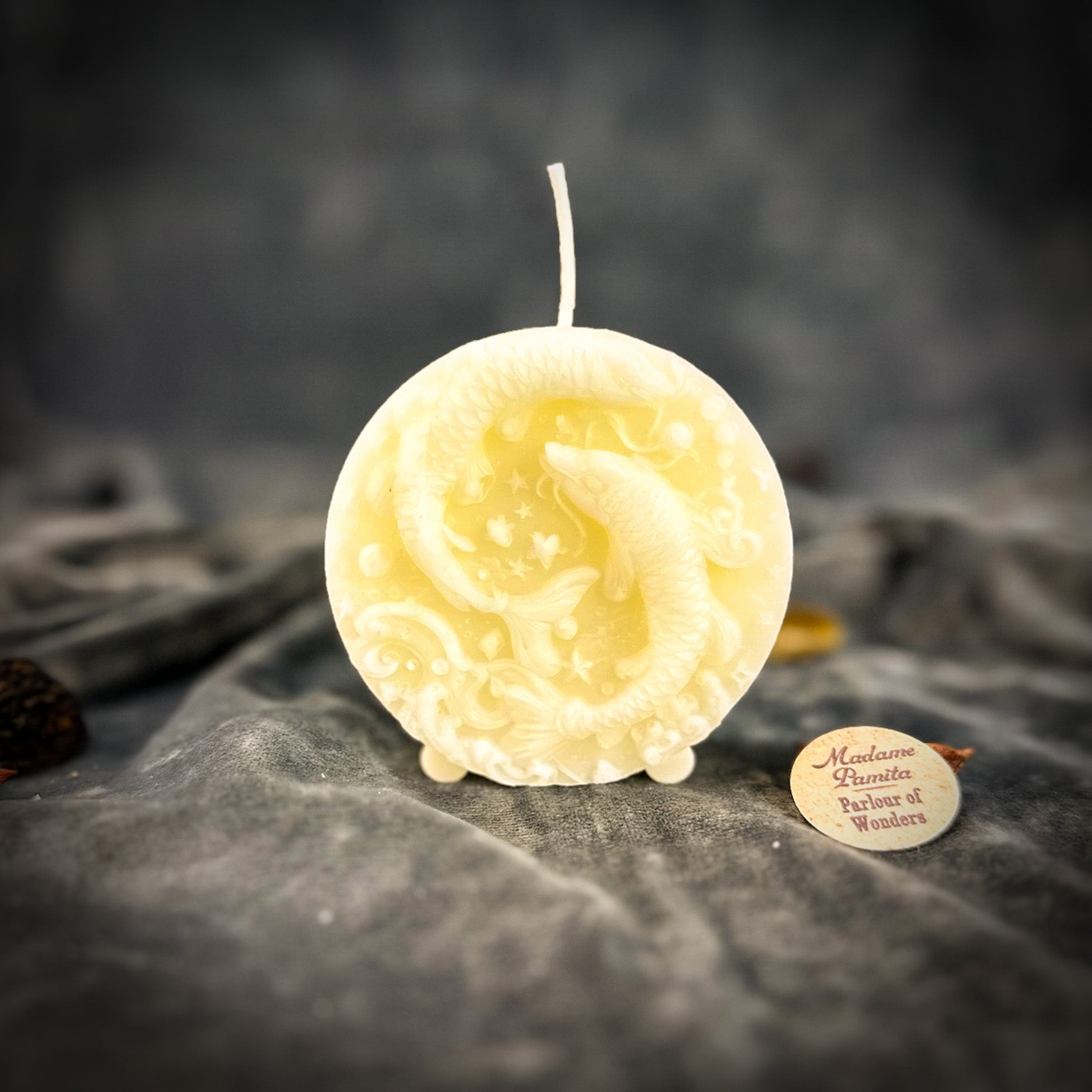 Purple beeswax Pisces fish zodiac spell candle by Parlour of Wonders with zodiac symbols, representing intuition, compassion, and dreams.