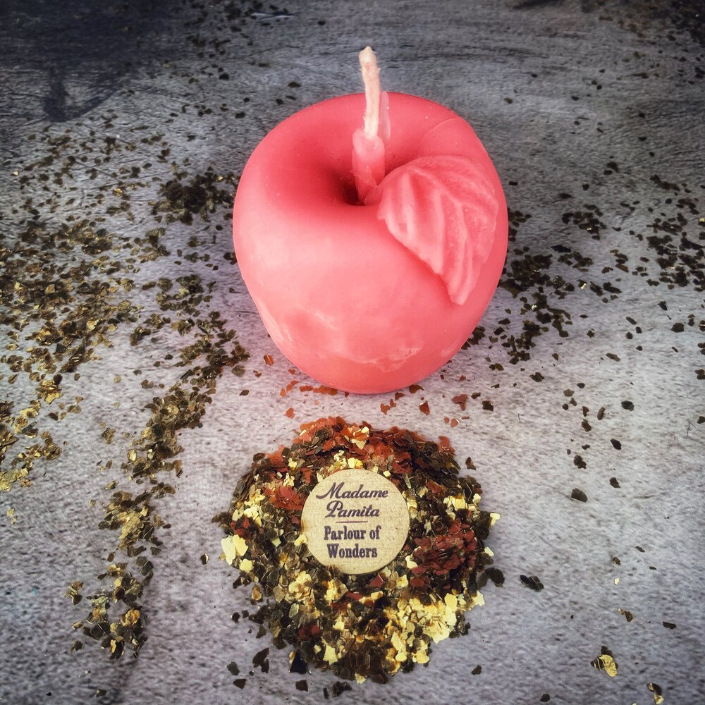 Red beeswax Apple of Avalon spell candle by Parlour of Wonders, used for love and abundance magic.