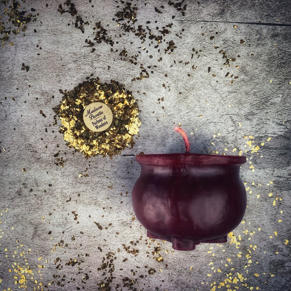 Red beeswax cauldron of magick spell candle by Parlour of Wonders, used for transformation and positive change magic.