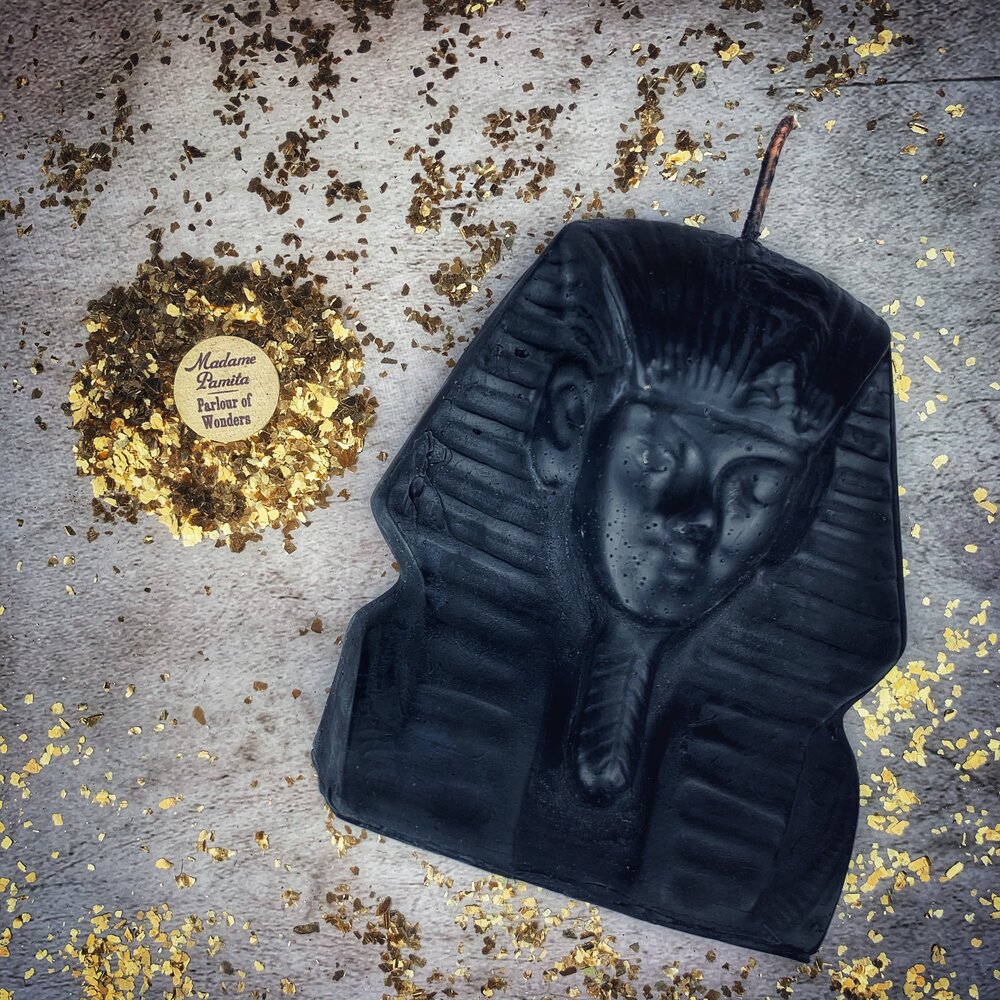 Red beeswax Egyptian King Spell Candle by Parlour of Wonders, featuring intricate hieroglyphic designs for power and magnetism magic.