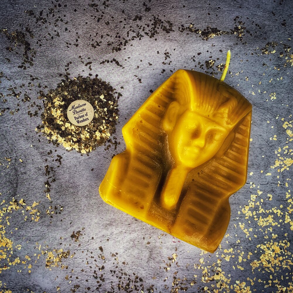 Red beeswax Egyptian King Spell Candle by Parlour of Wonders, featuring intricate hieroglyphic designs and a regal appearance.