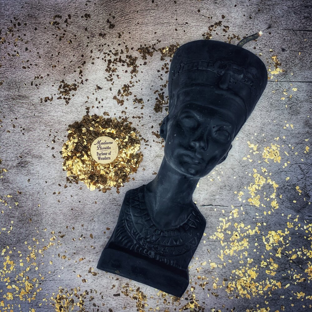 Red beeswax Egyptian Queen Spell Candle by Parlour of Wonders, featuring intricate design for power, beauty, and magnetism magic.