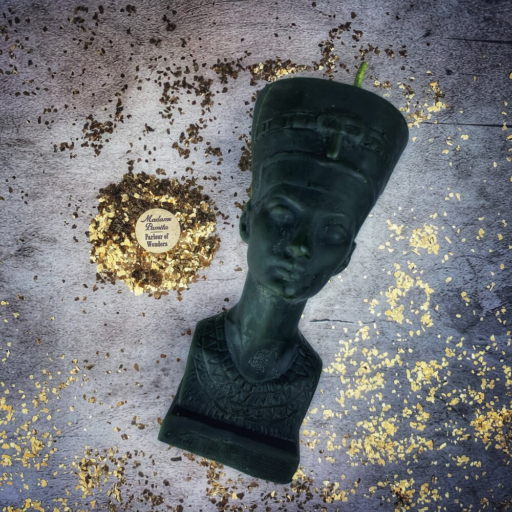 Red beeswax Egyptian Queen spell candle by Parlour of Wonders, featuring intricate design symbolizing power, beauty, and magnetism magic.