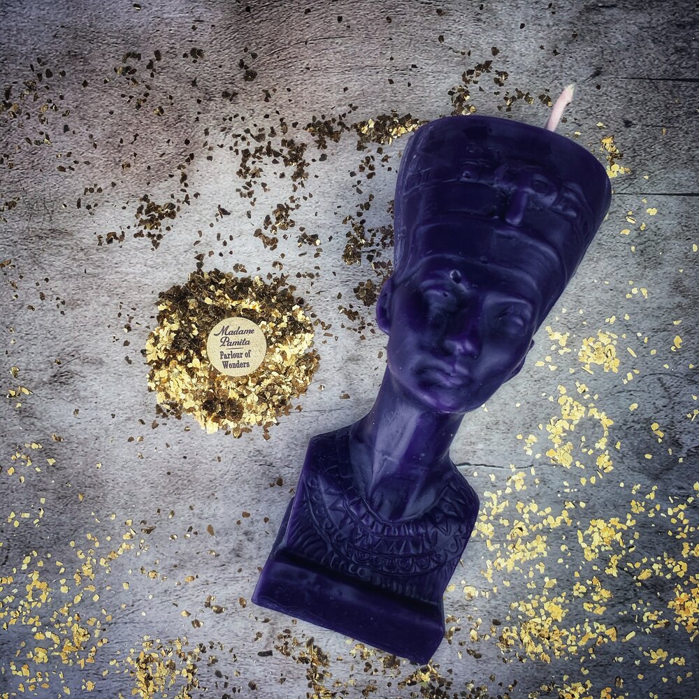 Red beeswax Egyptian Queen spell candle by Parlour of Wonders, showcasing detailed carvings and a powerful, mystical design.