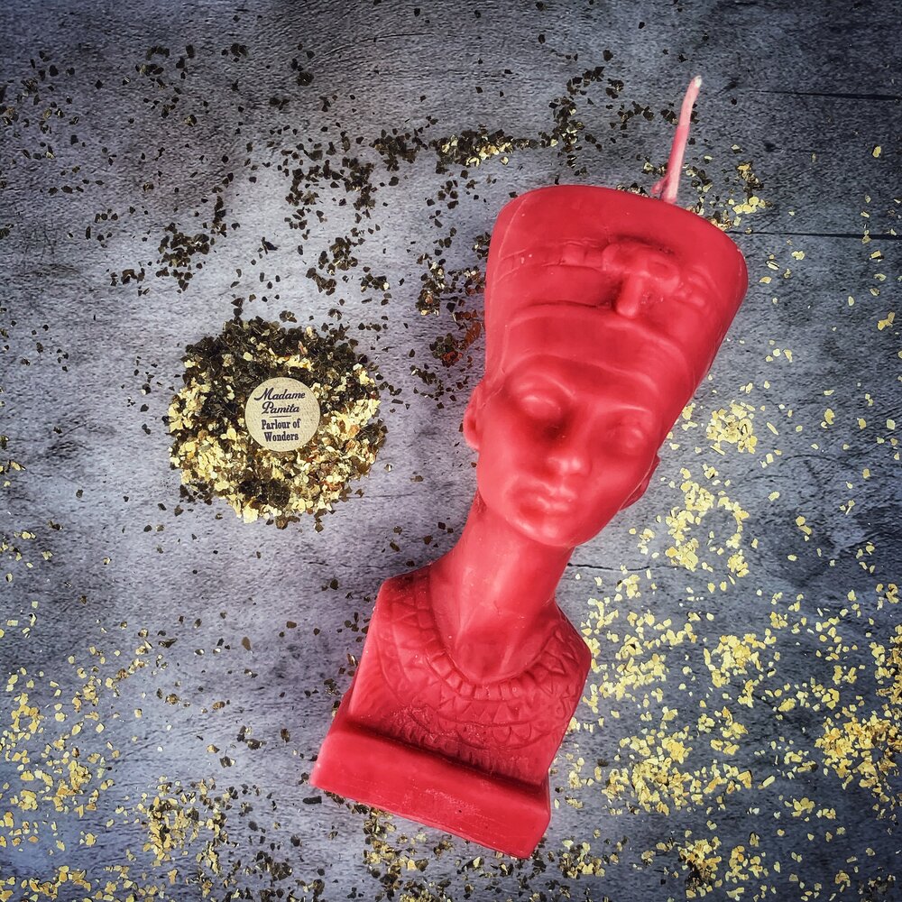 Red beeswax Egyptian Queen Spell Candle by Parlour of Wonders, featuring intricate design symbolizing power, beauty, and magnetism.