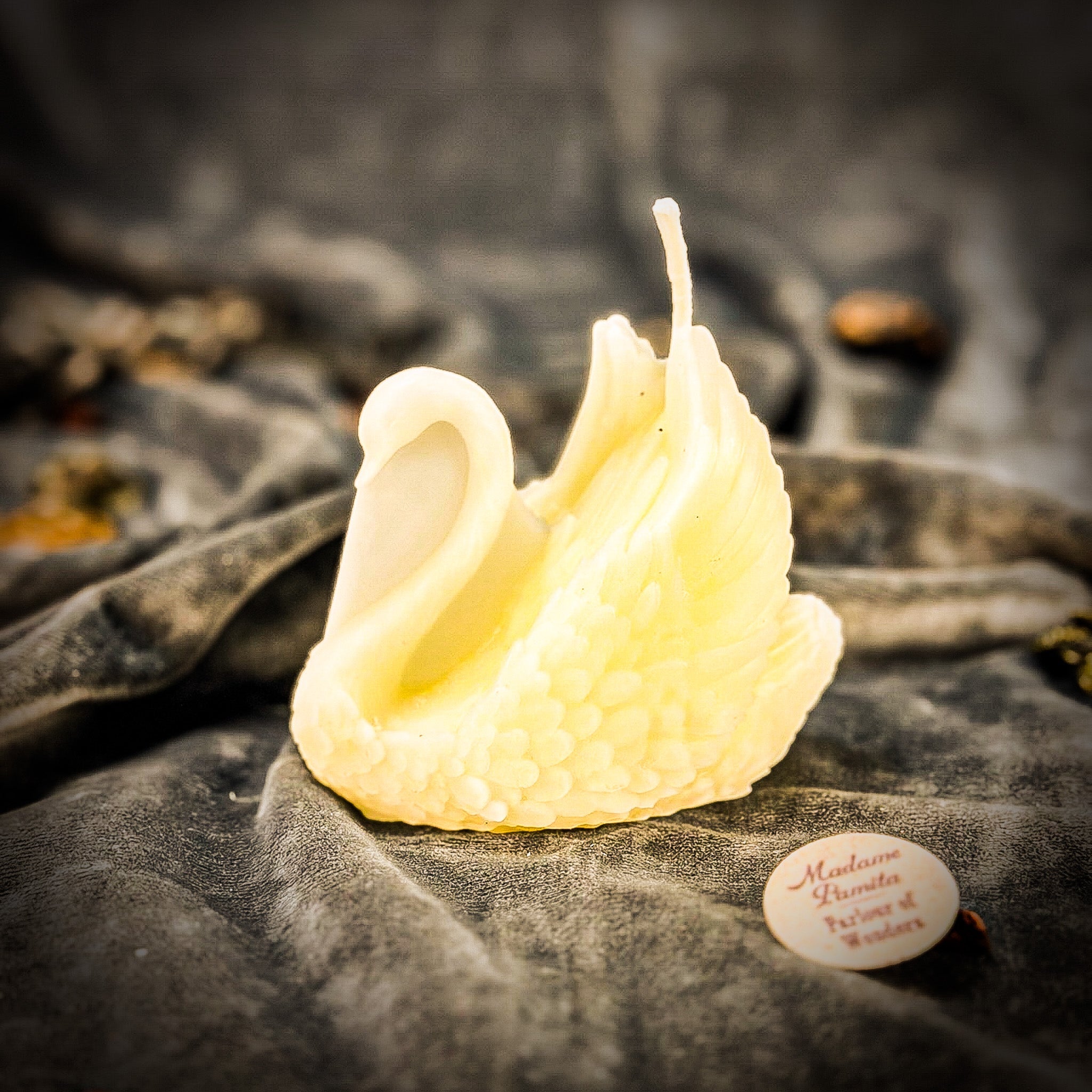 Beeswax elegant swan spell candle from Parlour of Wonders in deep red, showcasing graceful design and intricate detailing.