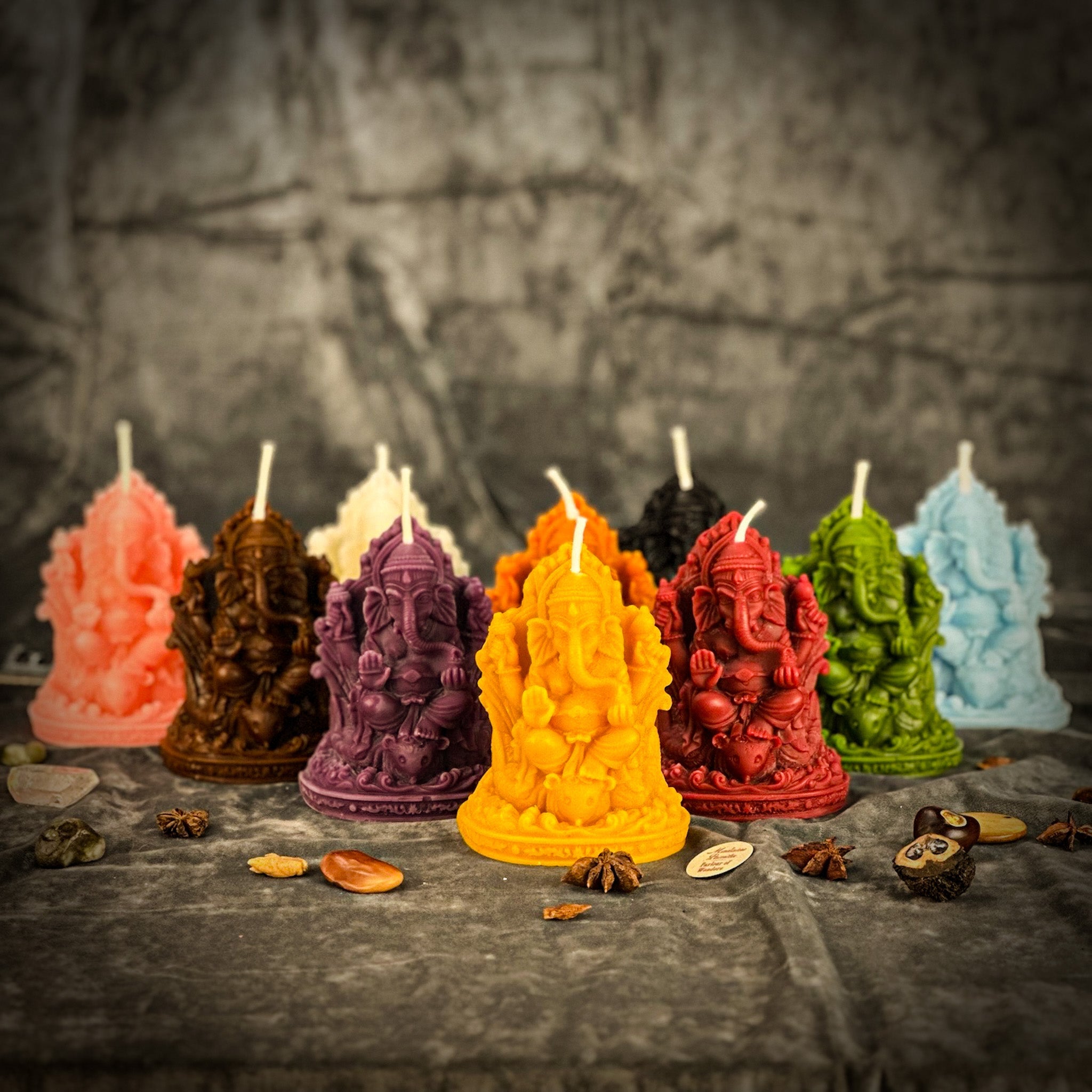 Red beeswax Ganesha spell candle by Parlour of Wonders for obstacle removal and success magic, featuring intricate Ganesha design.