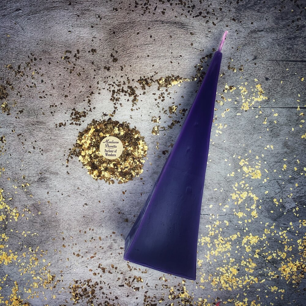 Red beeswax pyramid spell candle by Parlour of Wonders, designed for success and stability magic, with a long-lasting burn.