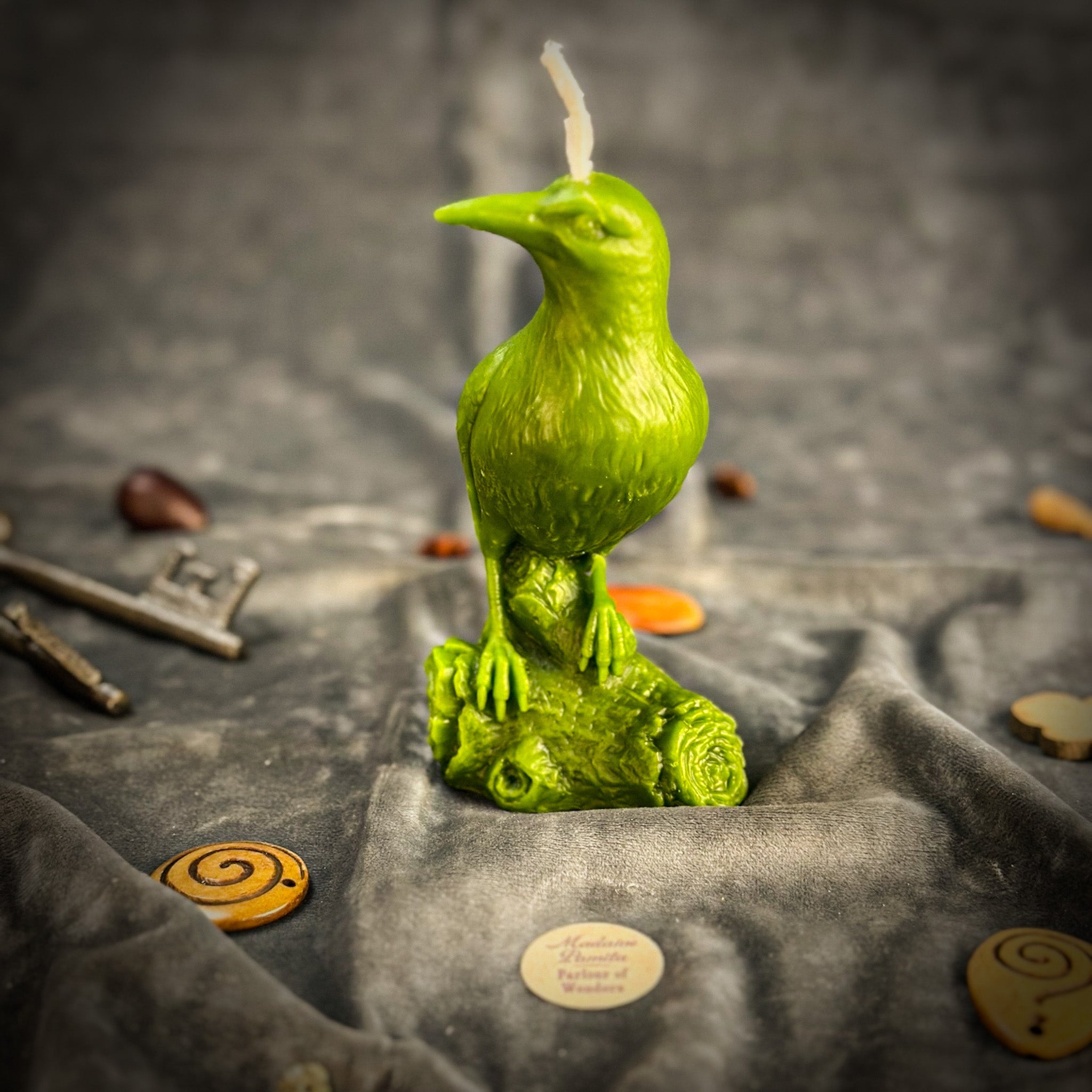 Red beeswax candle with a raven design by Parlour of Wonders for magic, intelligence, and spirit world connection.