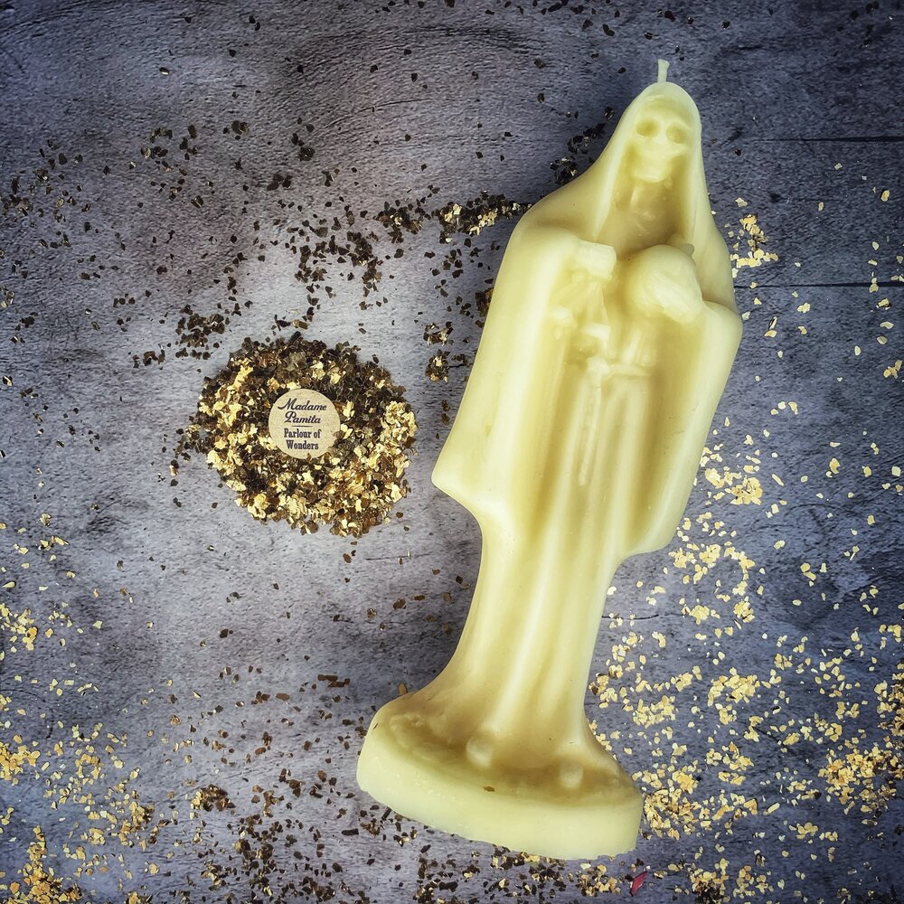 Red beeswax Santa Muerte spell candle from Parlour of Wonders, featuring sacred folk saint devotion and protection magic.