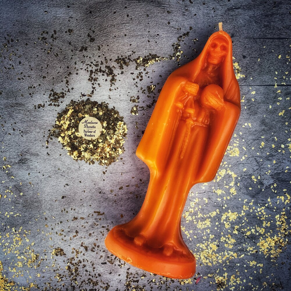 Beeswax Santa Muerte spell candle with red passion color, used for devotion and protection magic, from Parlour of Wonders.