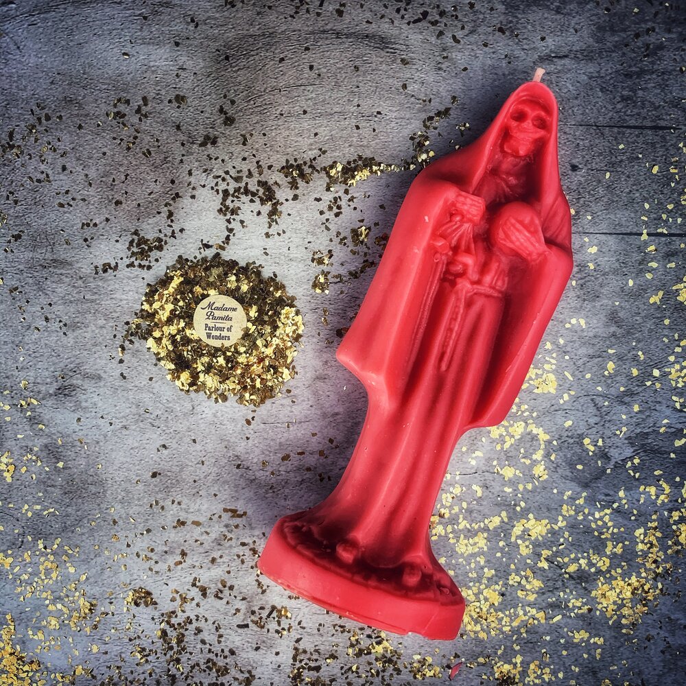 Red beeswax Santa Muerte spell candle from Parlour of Wonders, featuring sacred folk saint devotion and protection magic.
