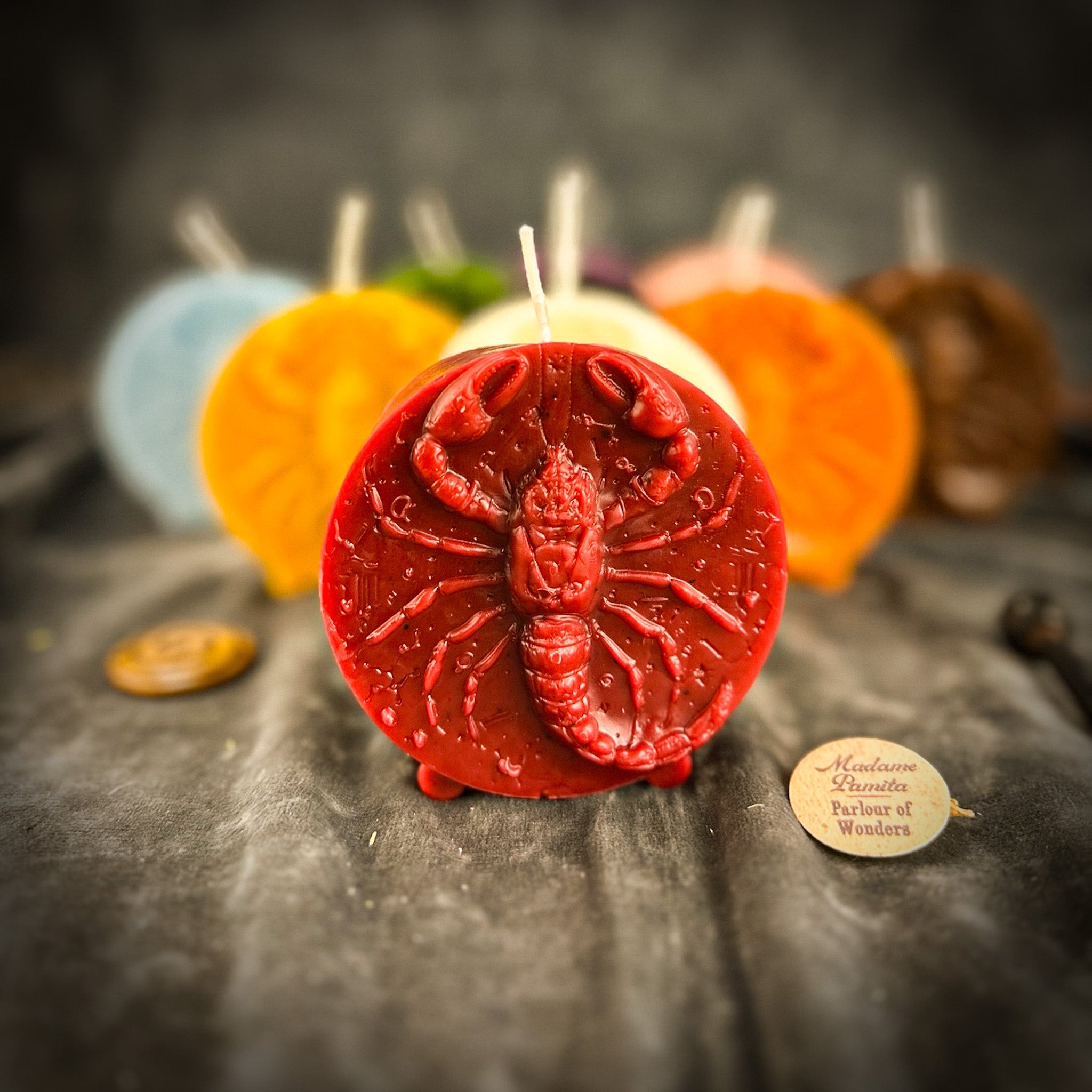 Red beeswax Scorpio zodiac spell candle with scorpion design, symbolizing transformation, power, and intuition.