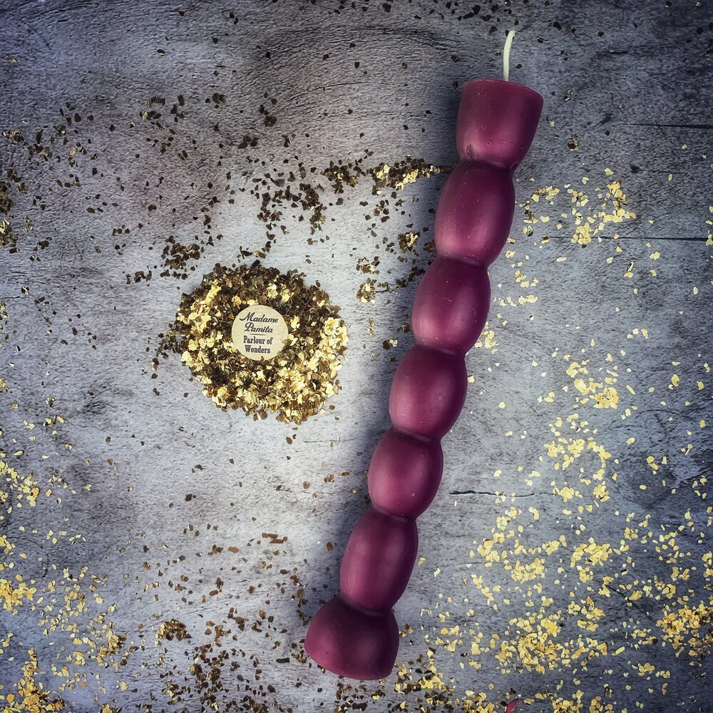 Red beeswax Seven Knob Spell Candle by Parlour of Wonders, designed for seven-day manifestation magic.