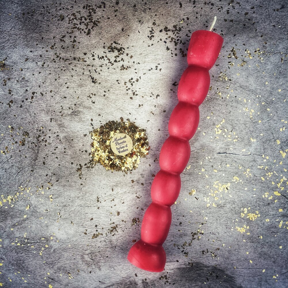 Red beeswax seven-knob spell candle by Parlour of Wonders for seven-day manifestation and magic rituals.