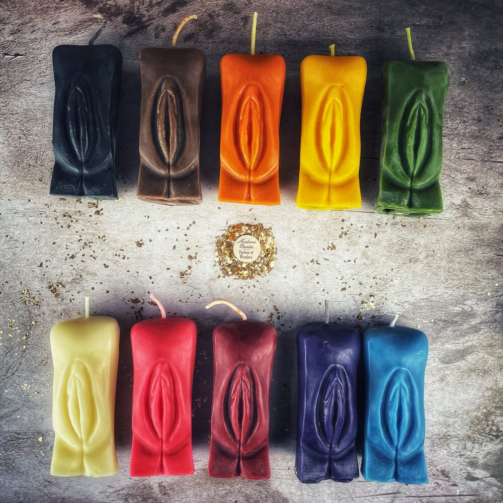 Red beeswax yoni vulva spell candle by Parlour of Wonders for passionate love and sex magic, featuring detailed vulva design.