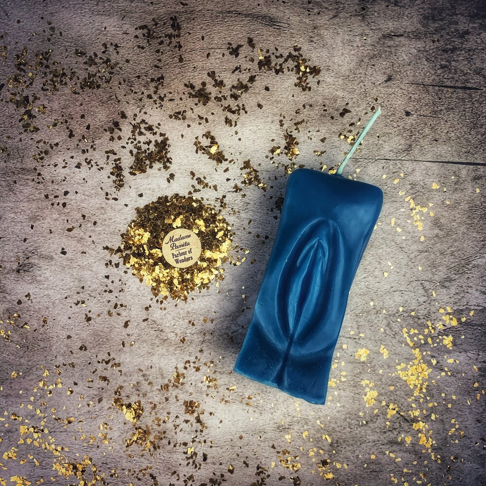 Red beeswax Yoni vulva spell candle by Parlour of Wonders, featuring intricate design for passionate love and sex magic rituals.
