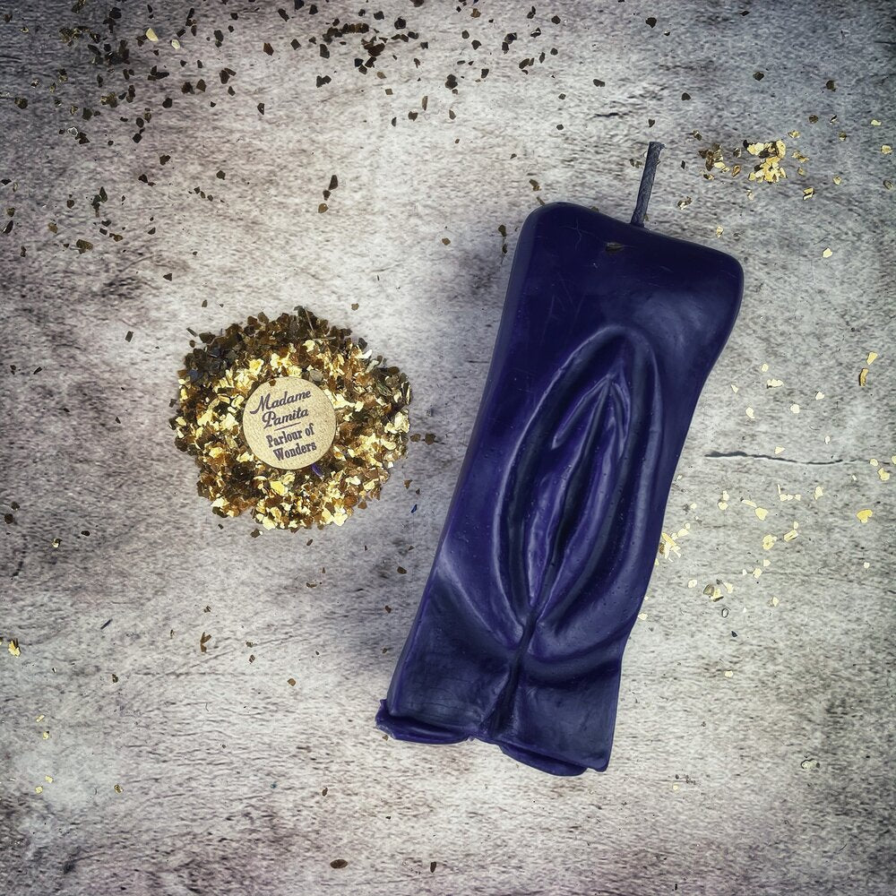 Red beeswax Yoni vulva spell candle by Parlour of Wonders for passionate love and sex magic, featuring detailed vulva design.