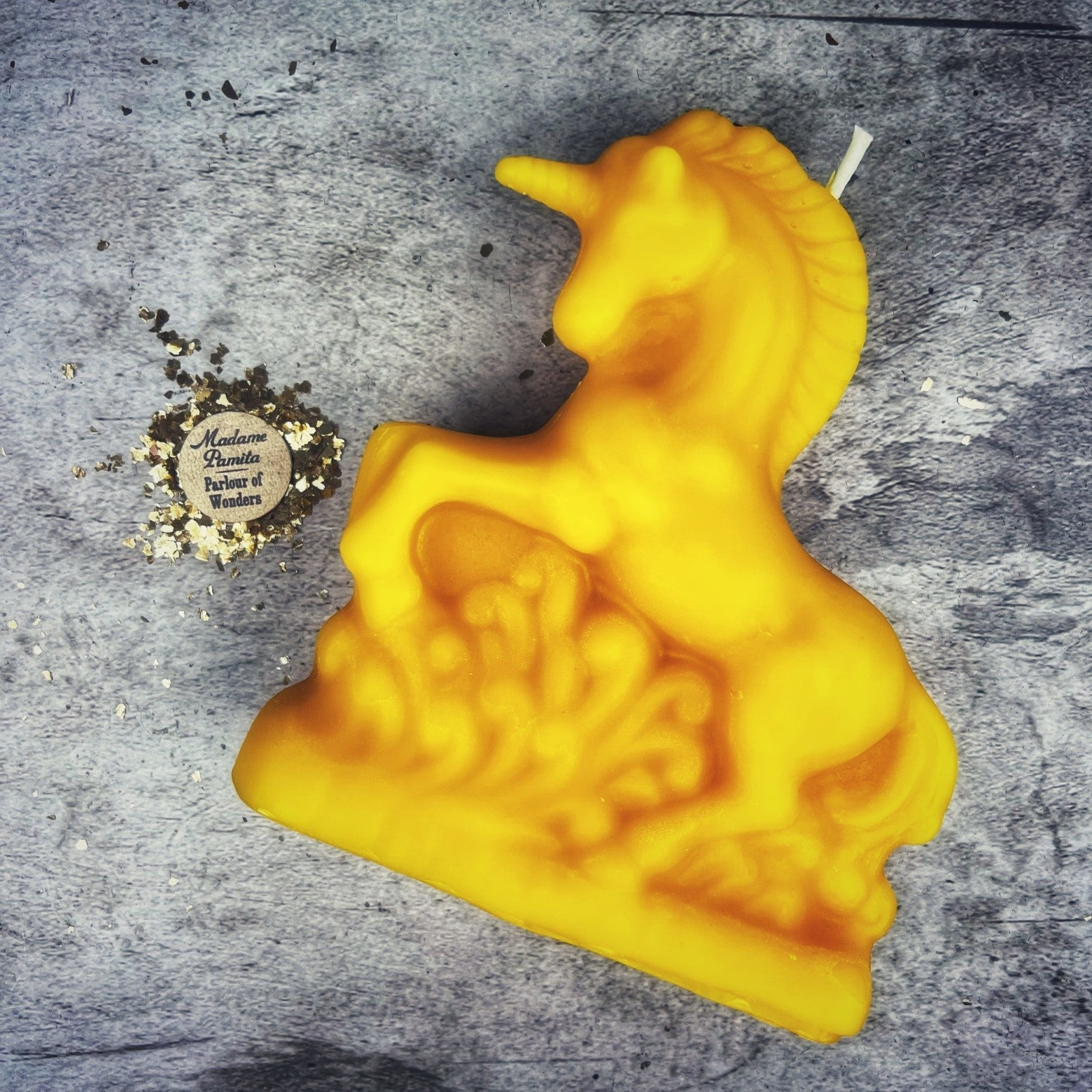 White beeswax unicorn spell candle from Parlour of Wonders, designed for manifestation and wish magic.