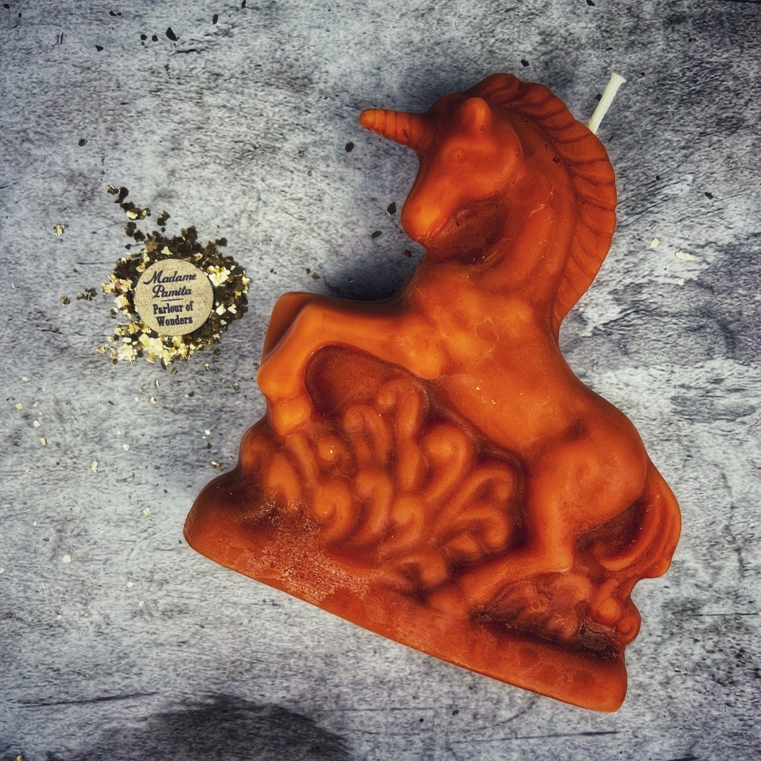 White beeswax unicorn spell candle by Parlour of Wonders, used for manifestation and wishes magic.