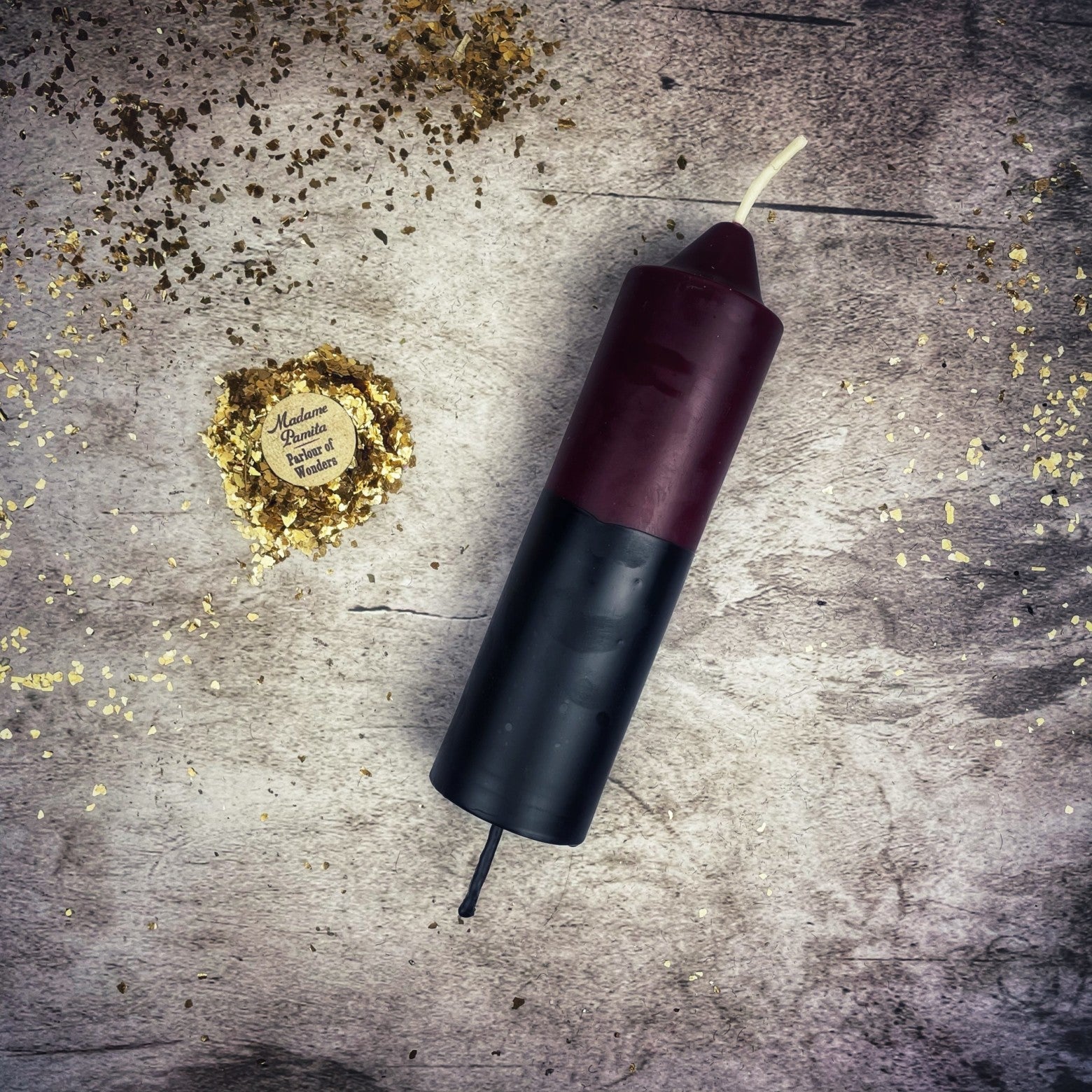 Yellow and black beeswax candle with double action reversing spell, designed for protection and curse reversal magic.